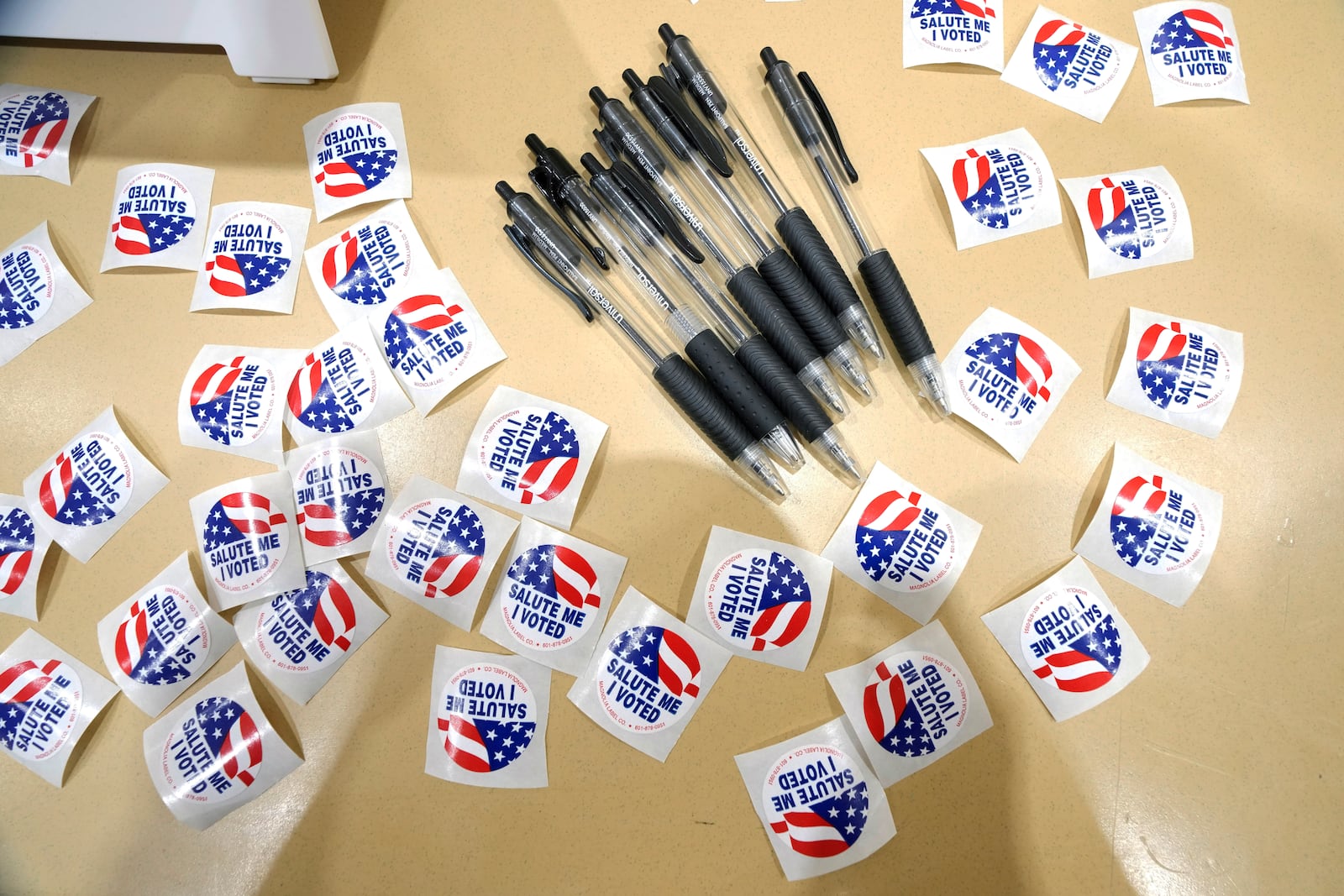 FILE - Pens are encircled by "I Voted" stickers at an election precinct in Jackson, Miss., March 12, 2024. (AP Photo/Rogelio V. Solis, File)