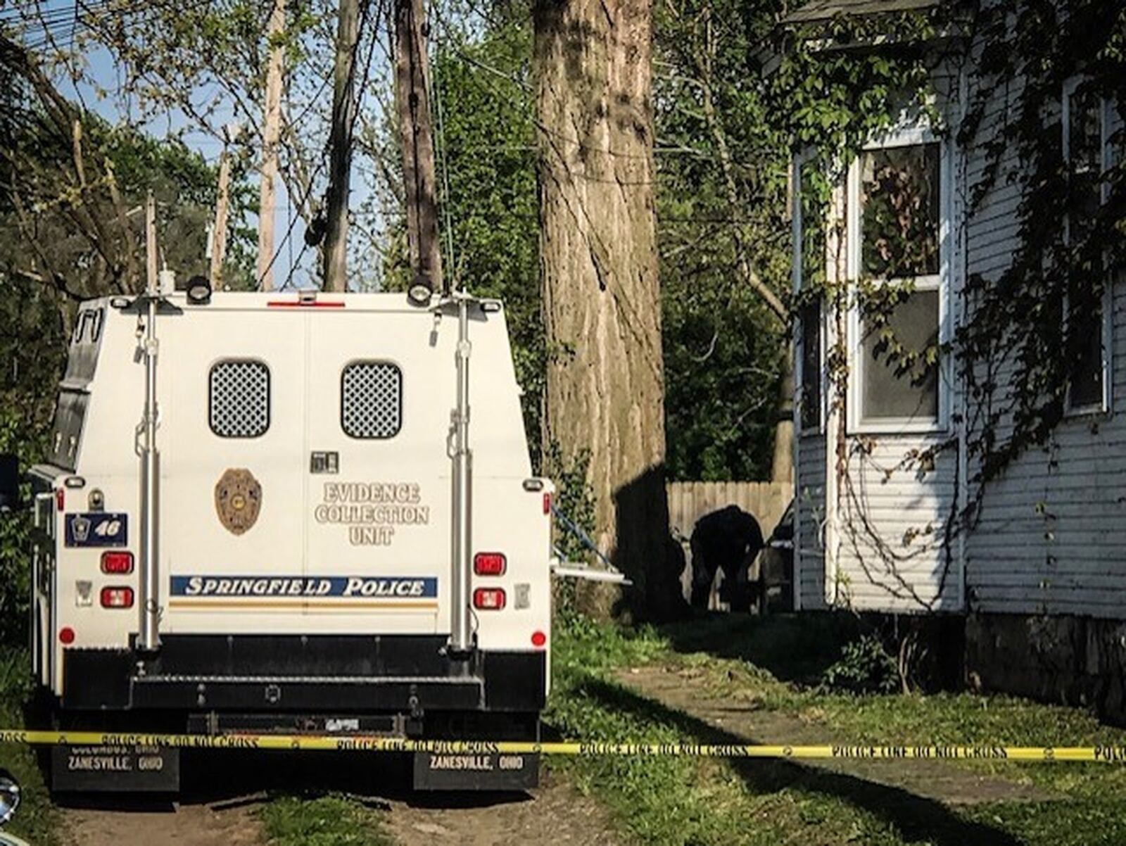 Investigators looked for evidence at the scene of a fatal shooting on Clifton Avenue on Monday afternoon. The coroner’s office identified a 50-year-old Springfield man as the victim. JENNA LAWSON/STAFF.