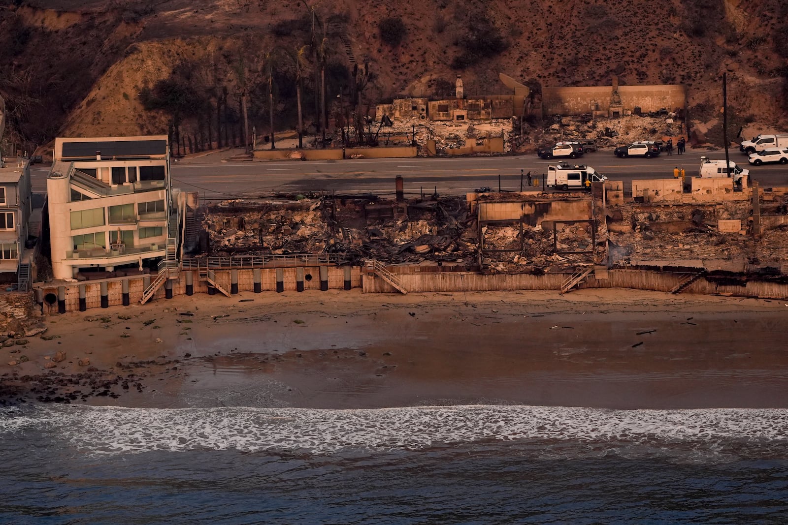 Beach front properties are left destroyed by the Palisades Fire, in this aerial view, Thursday, Jan. 9, 2025 in Malibu, Calif. (AP Photo/Mark J. Terrill)