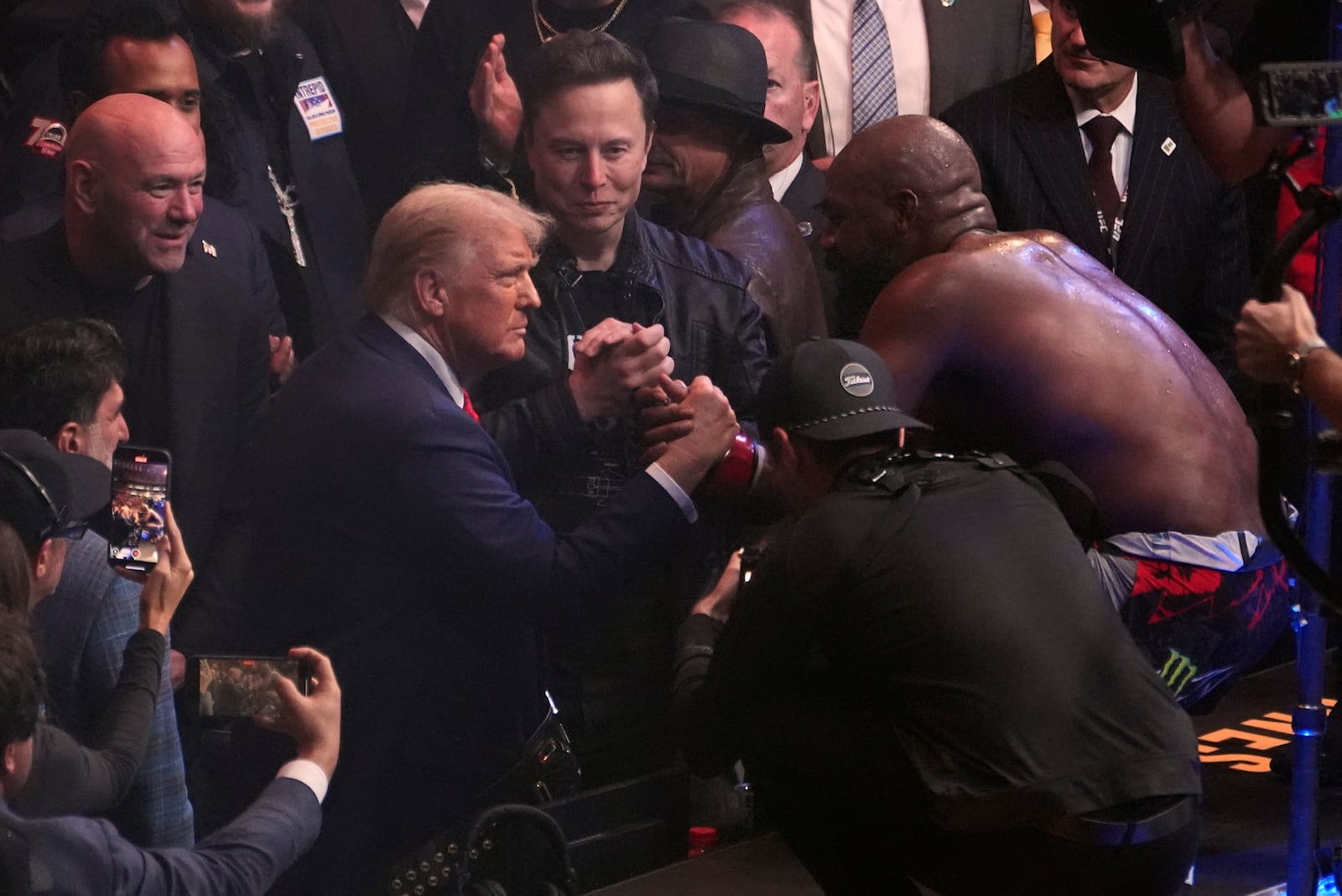 President-elect Donald Trump greets Jon Jones after he defeated Stipe Miocic at UFC 309 at Madison Square Garden, early Sunday, Nov. 17, 2024, in New York. (AP Photo/Evan Vucci)