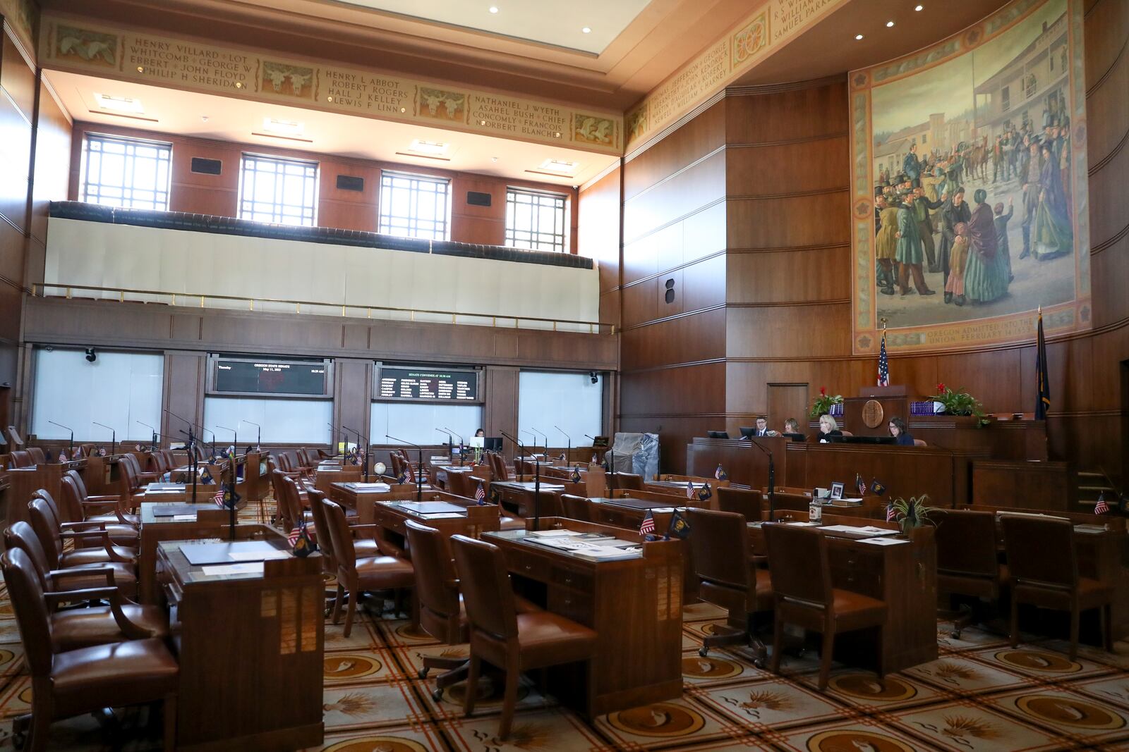 FILE - A view of the almost empty Senate chambers prior to a legislative session at the Oregon State Capitol in Salem, Ore., May 11, 2023. Republicans and an Independent senator in the Oregon Senate stretched their walkout to 10 days, triggering a new constitutional provision that prohibits lawmakers with 10 or more unexcused absences from being reelected. (AP Photo/Amanda Loman, File)