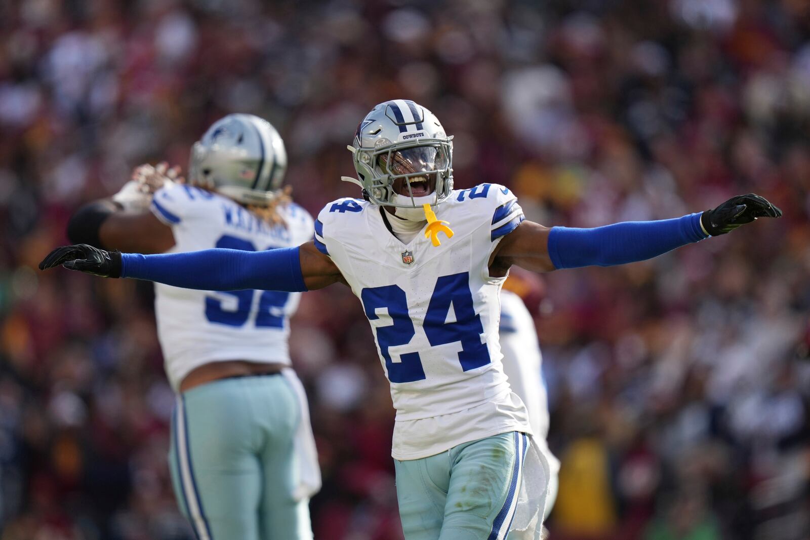 Dallas Cowboys safety Israel Mukuamu (24) celebrates after a missed field goal attempt by Washington Commanders place kicker Austin Seibert (3) during the first half of an NFL football game, Sunday, Nov. 24, 2024, in Landover, Md. (AP Photo/Stephanie Scarbrough)