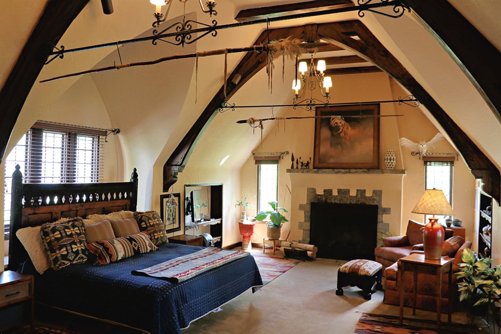 The second-floor great room was converted into the primary bedroom with a redesigned full bathroom and walk-in closet with laundry.