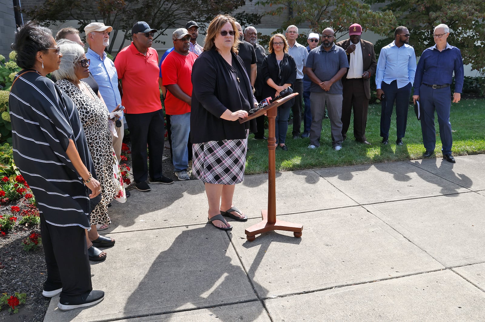 Rev. Jody Noble of Covenant Presbyterian Church opens a press conference held by Springfield clergy members Thursday, Sept. 12, 2024, to call for welcoming and acceptance of Haitian immigrants in the city. BILL LACKEY/STAFF