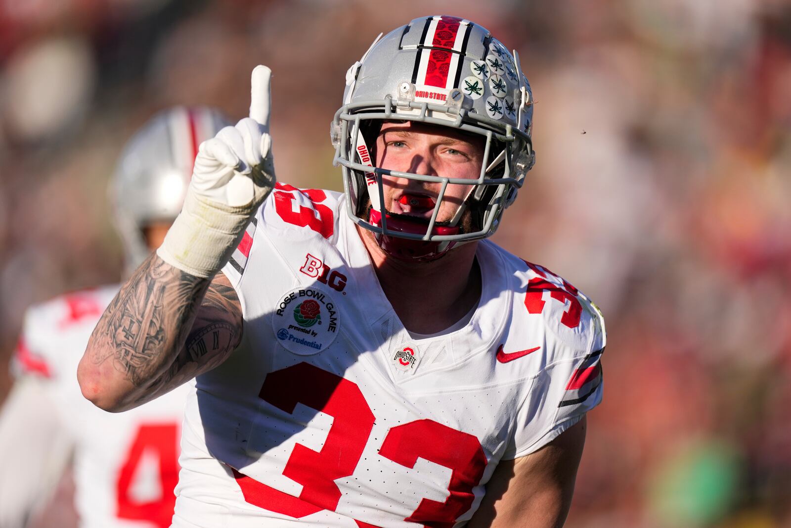 Ohio State defensive end Jack Sawyer (33) celebrates blocking a pass against Oregon during the first half in the quarterfinals of the Rose Bowl College Football Playoff, Wednesday, Jan. 1, 2025, in Pasadena, Calif. (AP Photo/Mark J. Terrill)