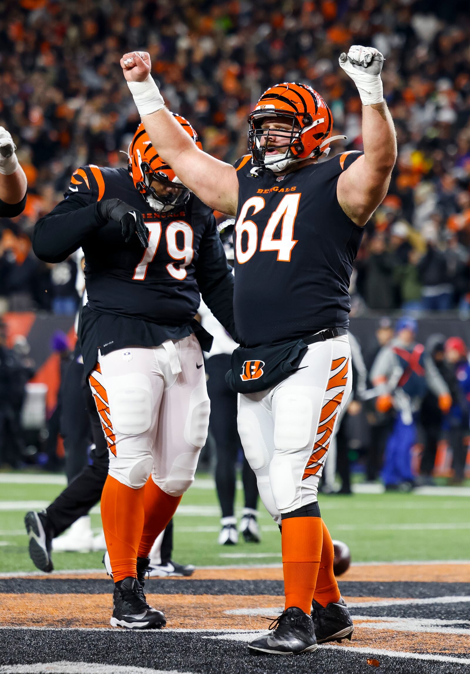 Bengals center Ted Karras celebrates a touchdown during Cincinnati's AFC Wild Card playoff game against the Baltimore Ravens Sunday, Jan. 15, 2023 at Paycor Stadium in Cincinnati. The Bengals won 24-17. NICK GRAHAM/STAFF