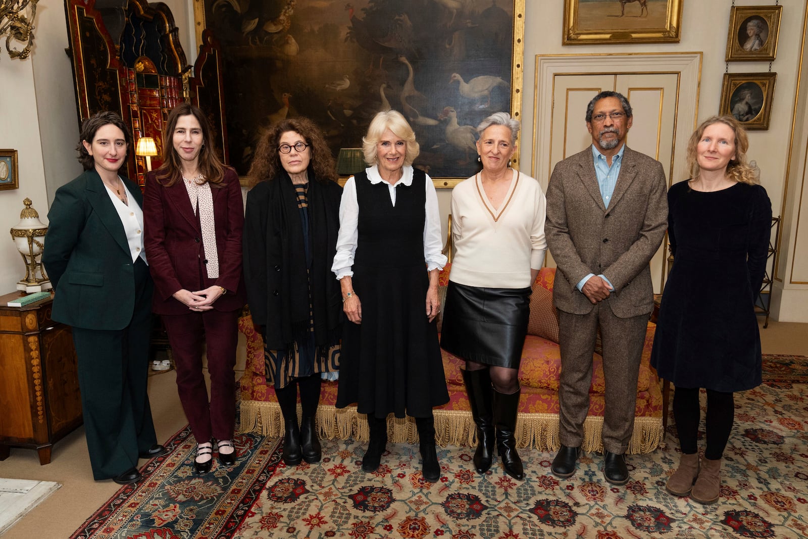 From left, Yael van der Wouden, Rachel Kushner, Anne Michaels, Britain's Queen Camilla, Charlotte Wood, Percival Everett, and Samantha Harvey pose during a reception for the Booker Prize Foundation at Clarence House, London, Tuesday Nov. 12, 2024. (Aaron Chown, Pool Photo via AP)