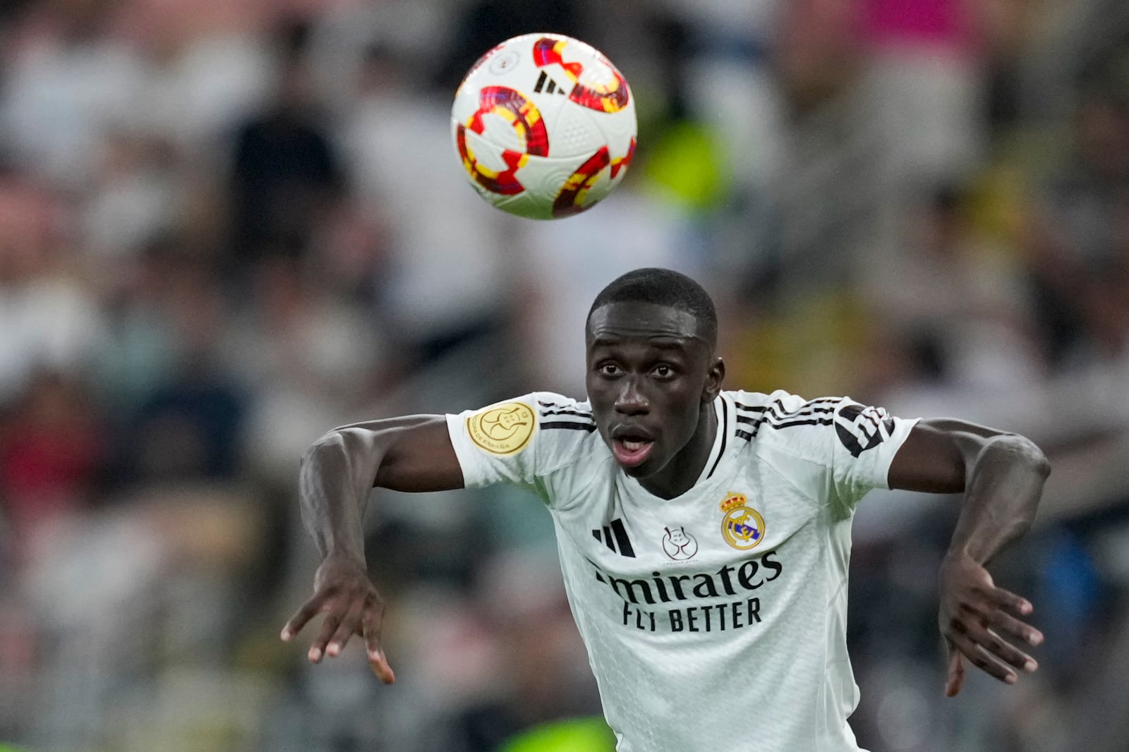 Real Madrid's Ferland Mendy throws the ball during the Spanish Super Cup semifinal soccer match between Real Madrid and Mallorca at the King Abdullah Stadium in Jeddah, Saudi Arabia, Thursday, Jan. 9, 2025. (AP Photo/Altaf Qadri)