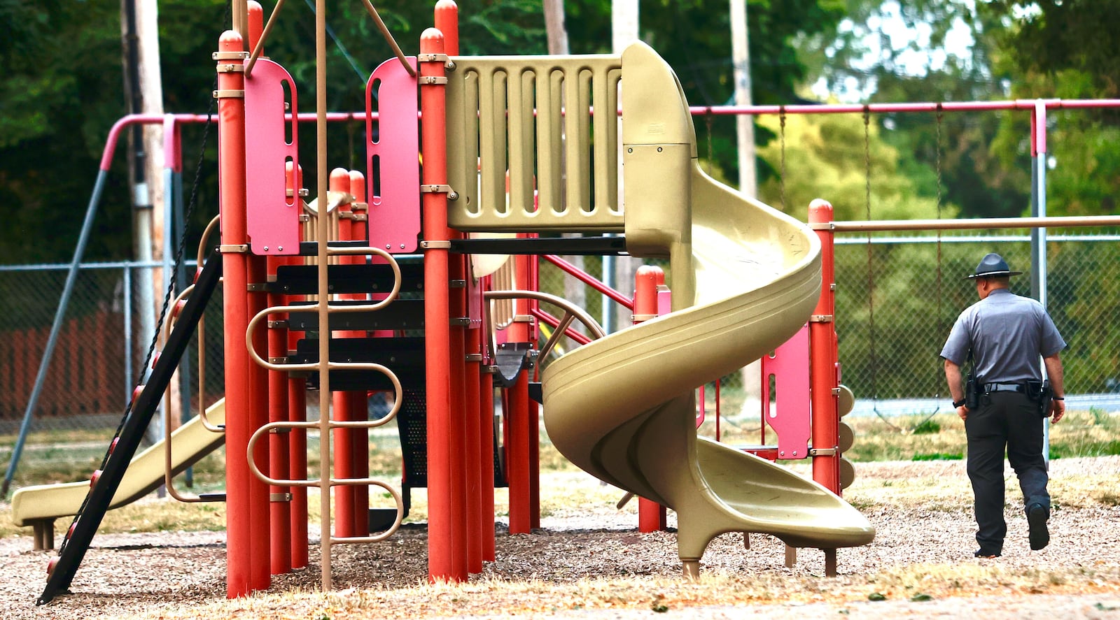 Members of the Ohio State Highway Patrol check the playground at Snowhill Elementary in Springfield before students arrive Tuesday, September 17, 2024. MARSHALL GORBY \STAFF