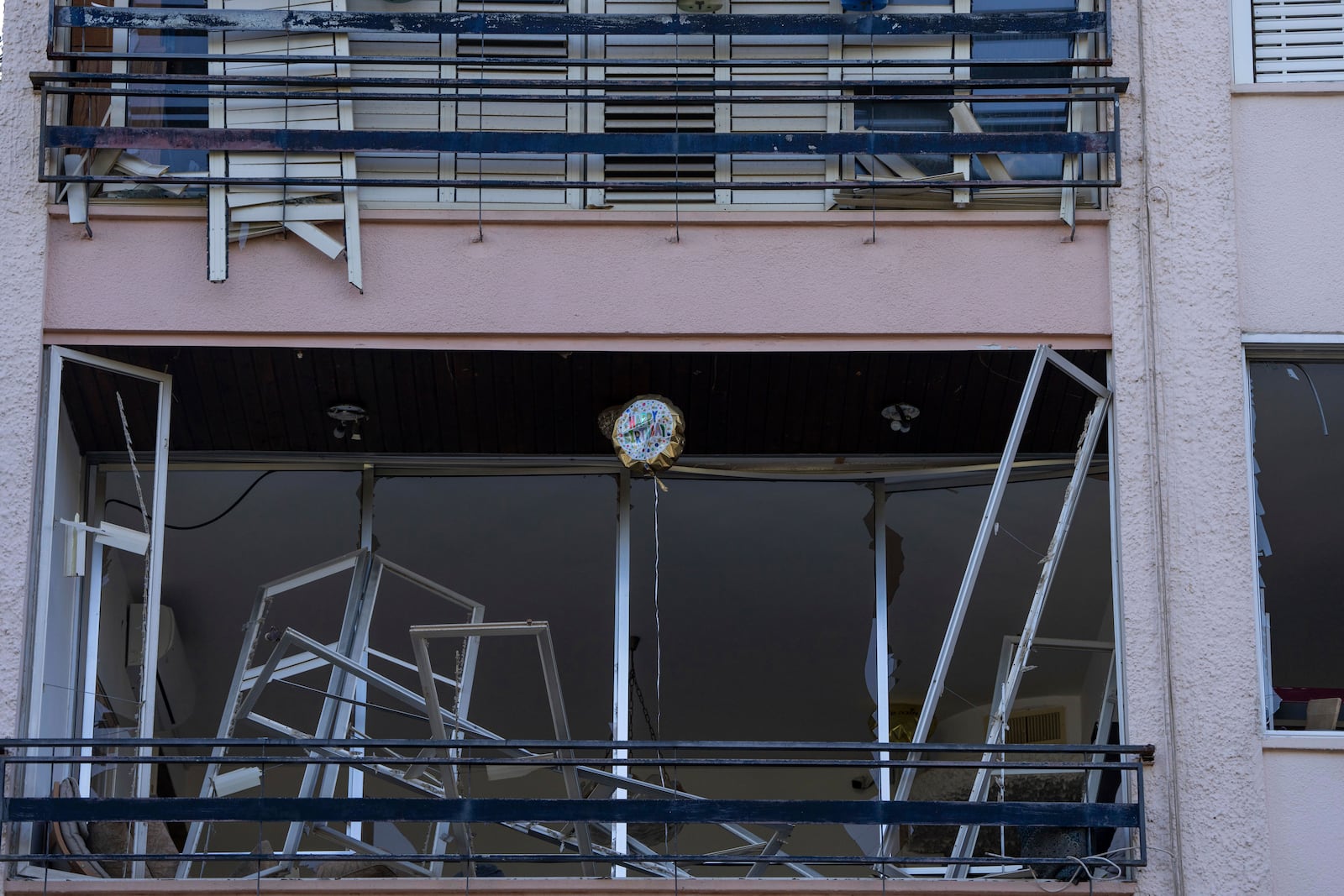 A destroyed building hit by a missile fired from Lebanon on Saturday, in Haifa, northern Israel, Sunday, Nov. 17, 2024. (AP Photo/Ohad Zwigenberg)