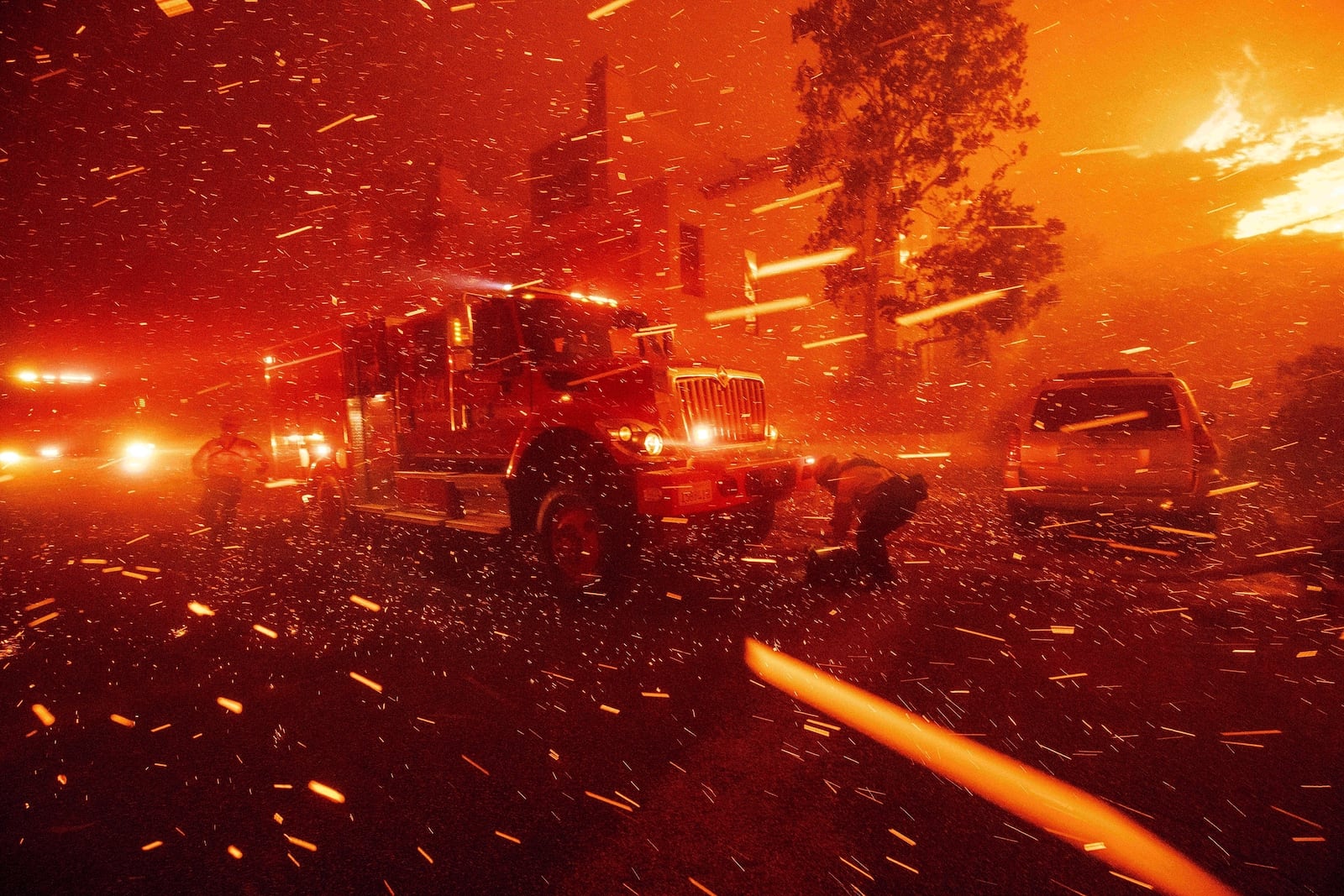 FILE - Firefighters battle the Franklin Fire in Malibu, Calif., Dec. 10, 2024. (AP Photo/Ethan Swope)