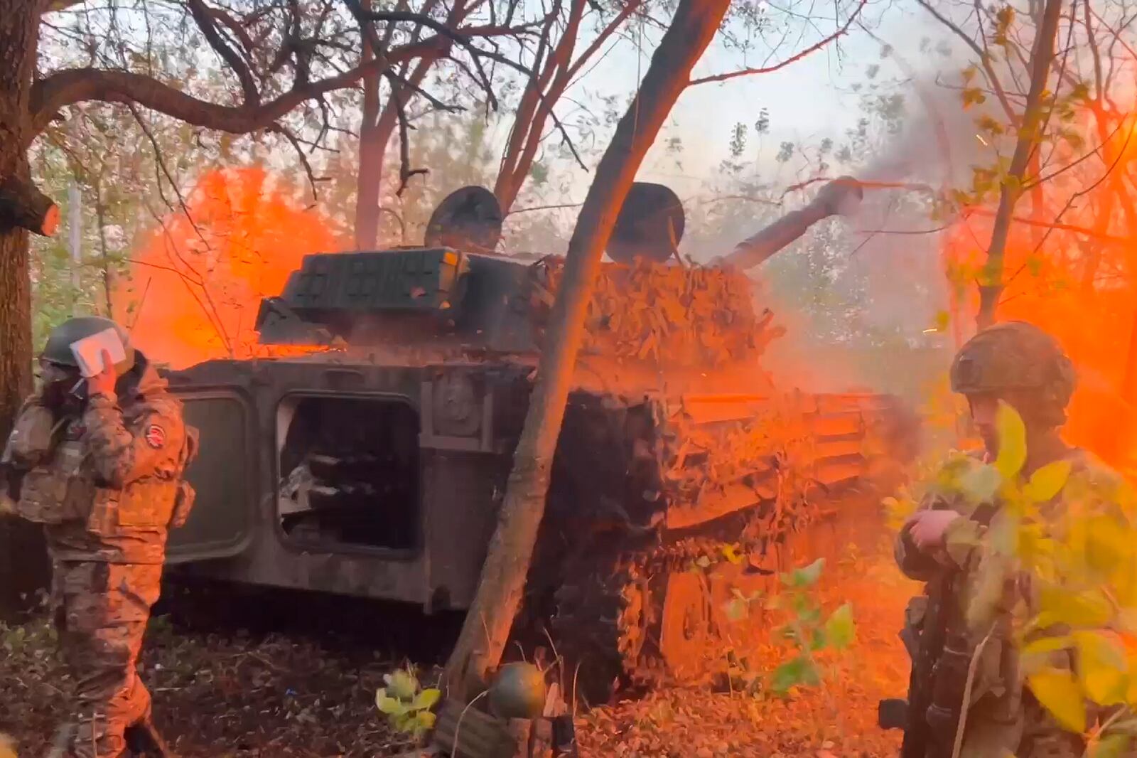 In this photo taken from a video released by Russian Defense Ministry press service on Wednesday, Oct. 30, 2024, Russian Gvozdika 120mm howitzer fires towards Ukrainian positions at border area of Kursk region, Russia. (Russian Defense Ministry Press Service via AP)