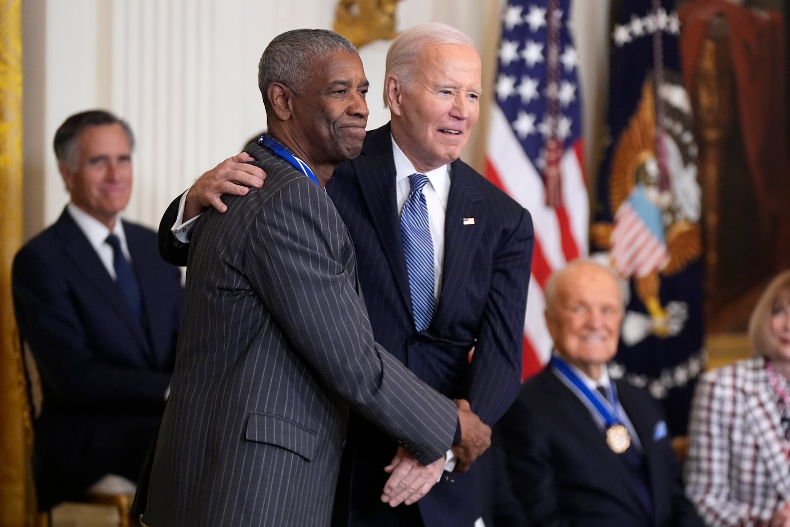 FILE - President Joe Biden, right, poses with Denzel Washington after presenting Washington with the Presidential Medal of Freedom, the Nation's highest civilian honor, in the East Room of the White House, Jan. 4, 2025, in Washington. (AP Photo/Manuel Balce Ceneta, File)