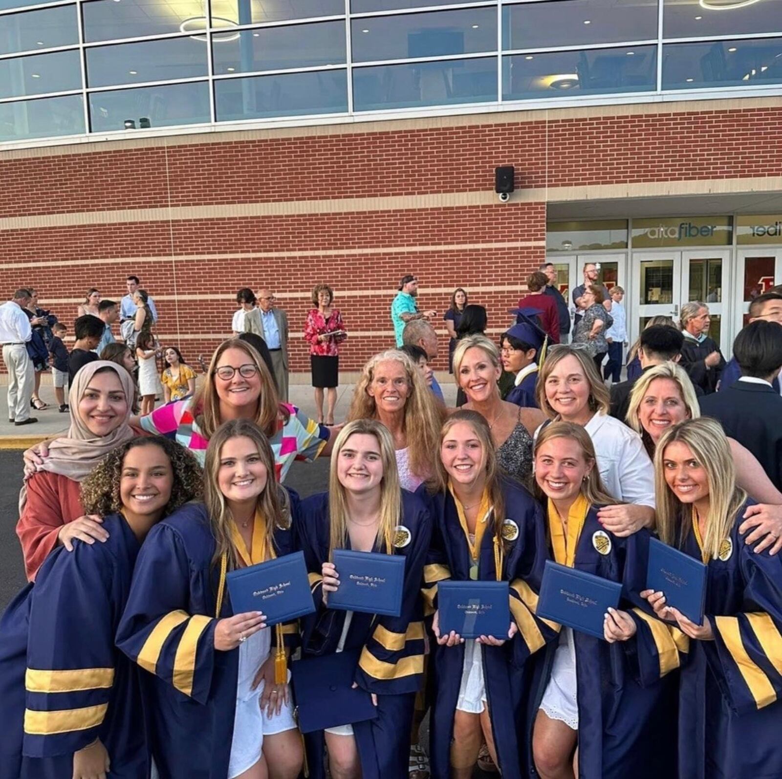 Emma Neff (center) surrounded by other Oakwood High grads and their mothers, including Emma’s mom Nancy (center back row).CONTRIBUTED