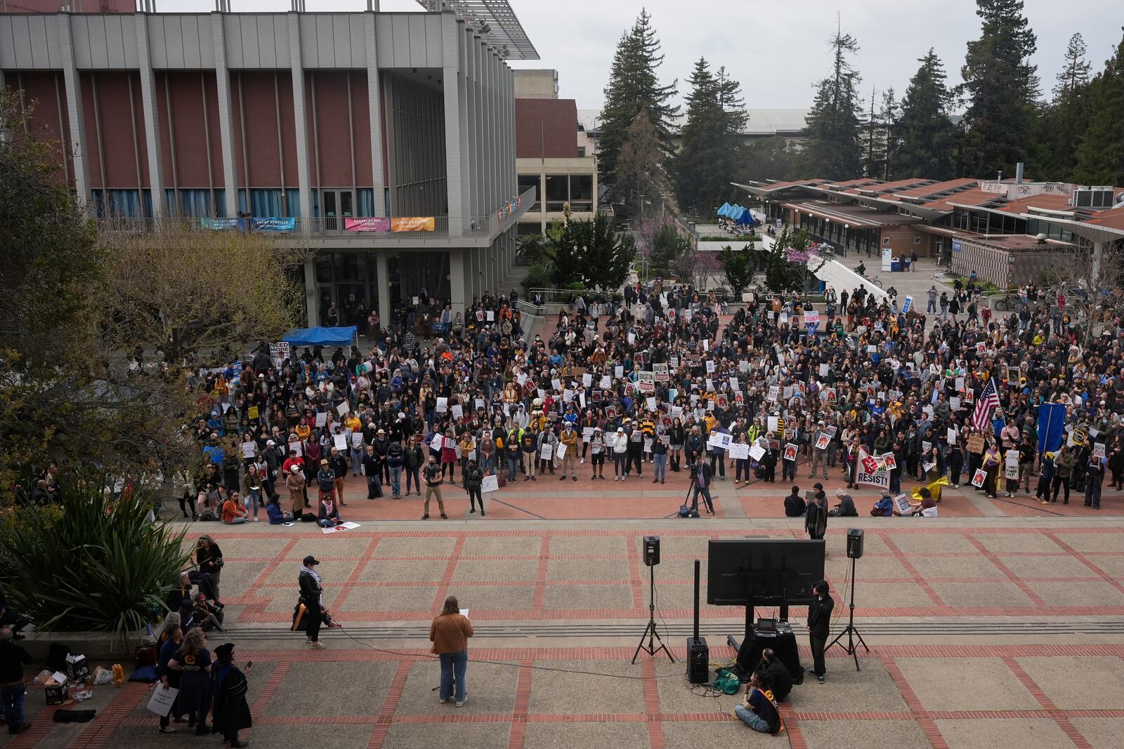 People rally at the University of California, Berkeley campus to protest the Trump administration Wednesday, March 19, 2025, in Berkeley, Calif. (AP Photo/Godofredo A. Vásquez)