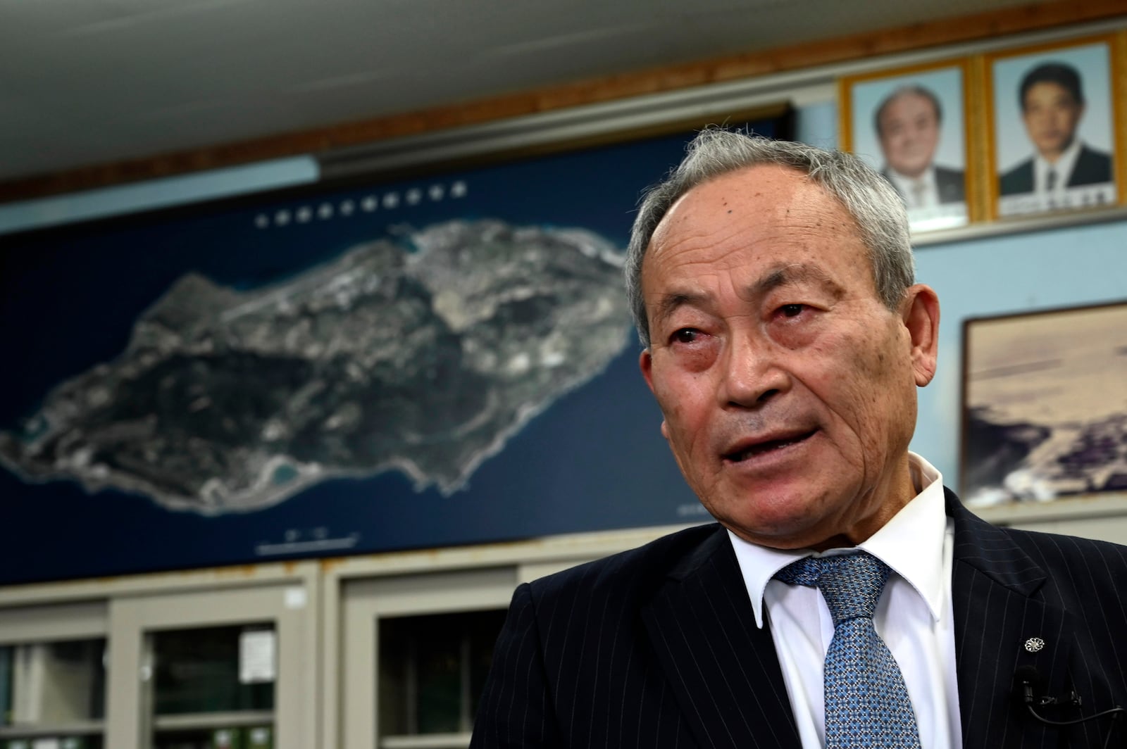 Yonaguni Mayor Kenichi Itokazu speaks during an interview with the AP on Yonaguni, a tiny island on Japan’s western frontier, Friday, Feb. 14, 2025. (AP Photo/Ayaka McGill)