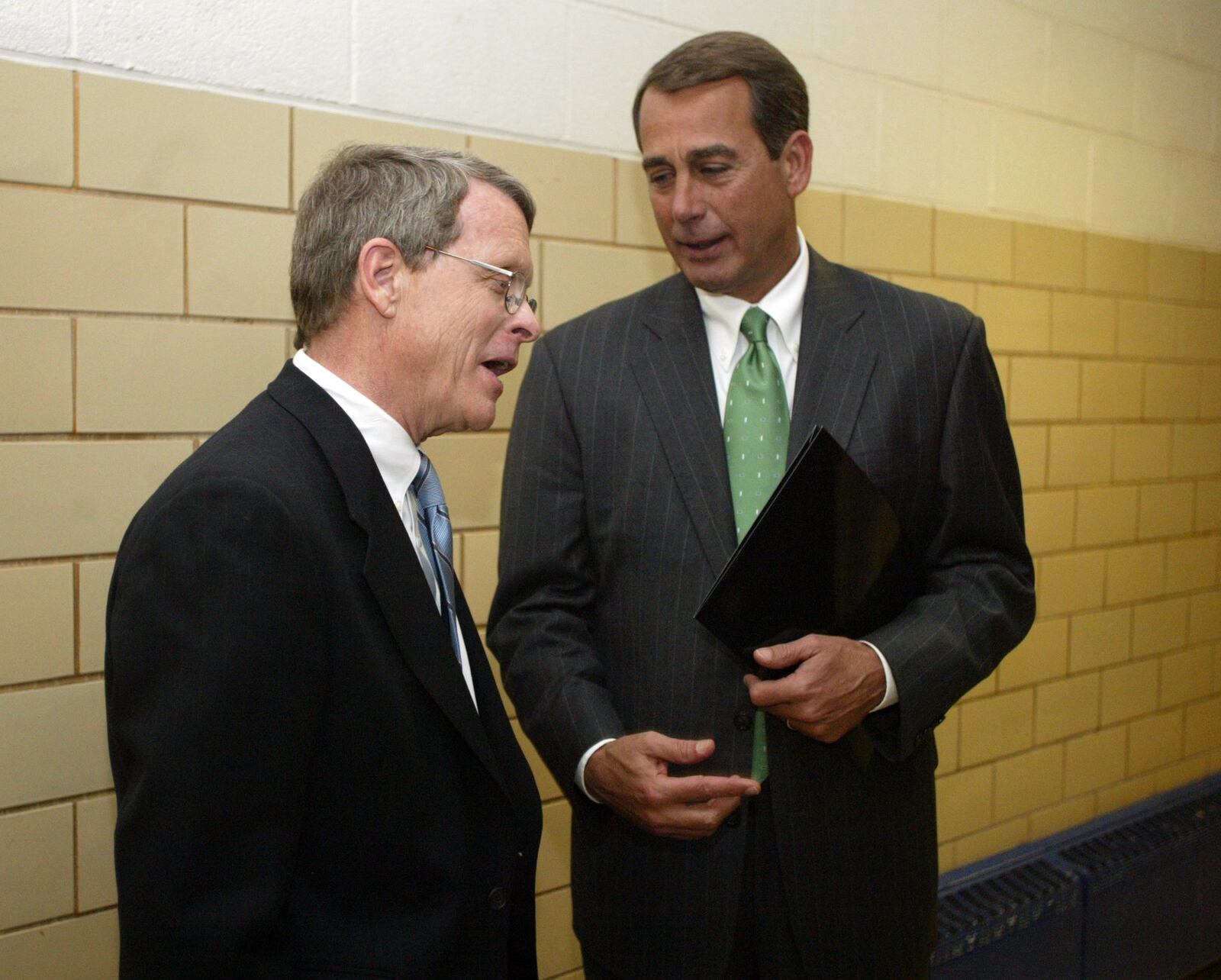 Senator Mike Dewine and Congressman John Boehner talk following Boehner’s keynote address in February 2006 behind the scene at the Miami County Republican convention held at Miami East High School near Casstown. PHOTO BY JAN UNDERWOOD