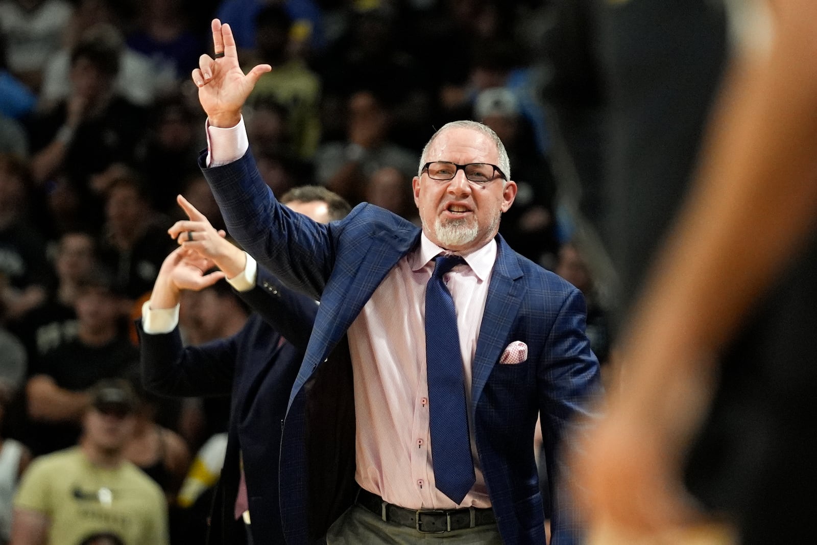 Texas A&M head coach Buzz Williams motions to his players during the first half of an NCAA college basketball game against Central Florida, Monday, Nov. 4, 2024, in Orlando, Fla. (AP Photo/John Raoux)