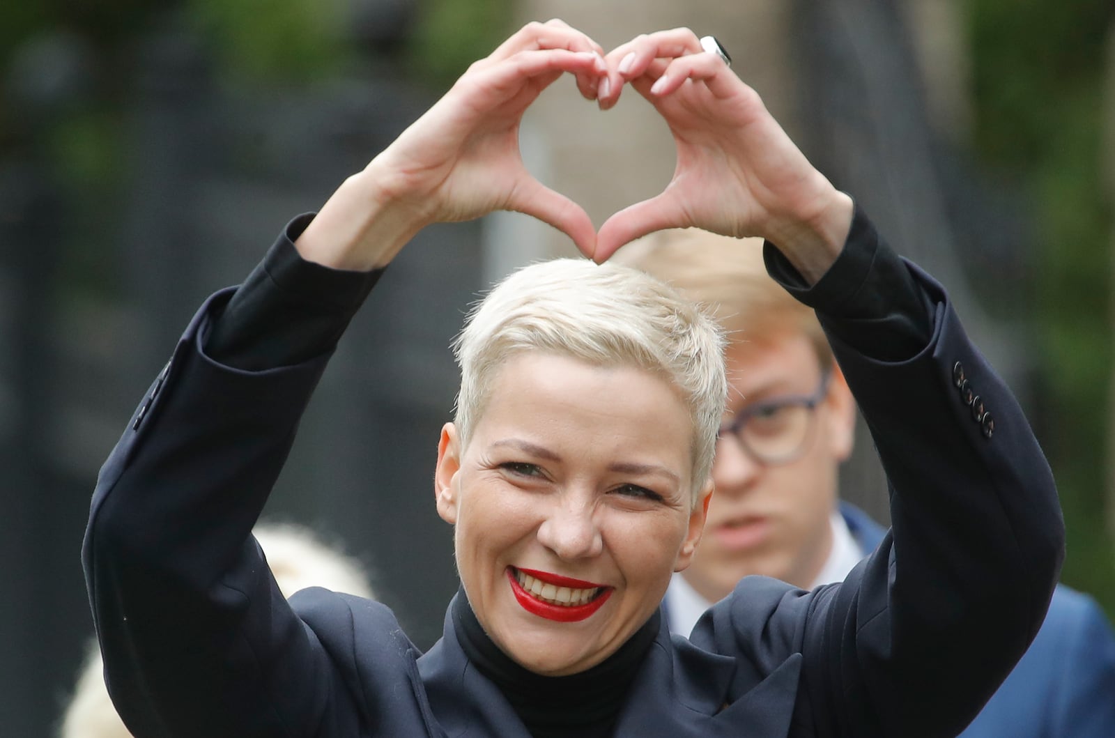 FILE – Belarus opposition activist Maria Kolesnikova gestures on the way to the Belarusian Investigative Committee in Minsk, Belarus, on Aug. 27, 2020. (AP Photo, File)