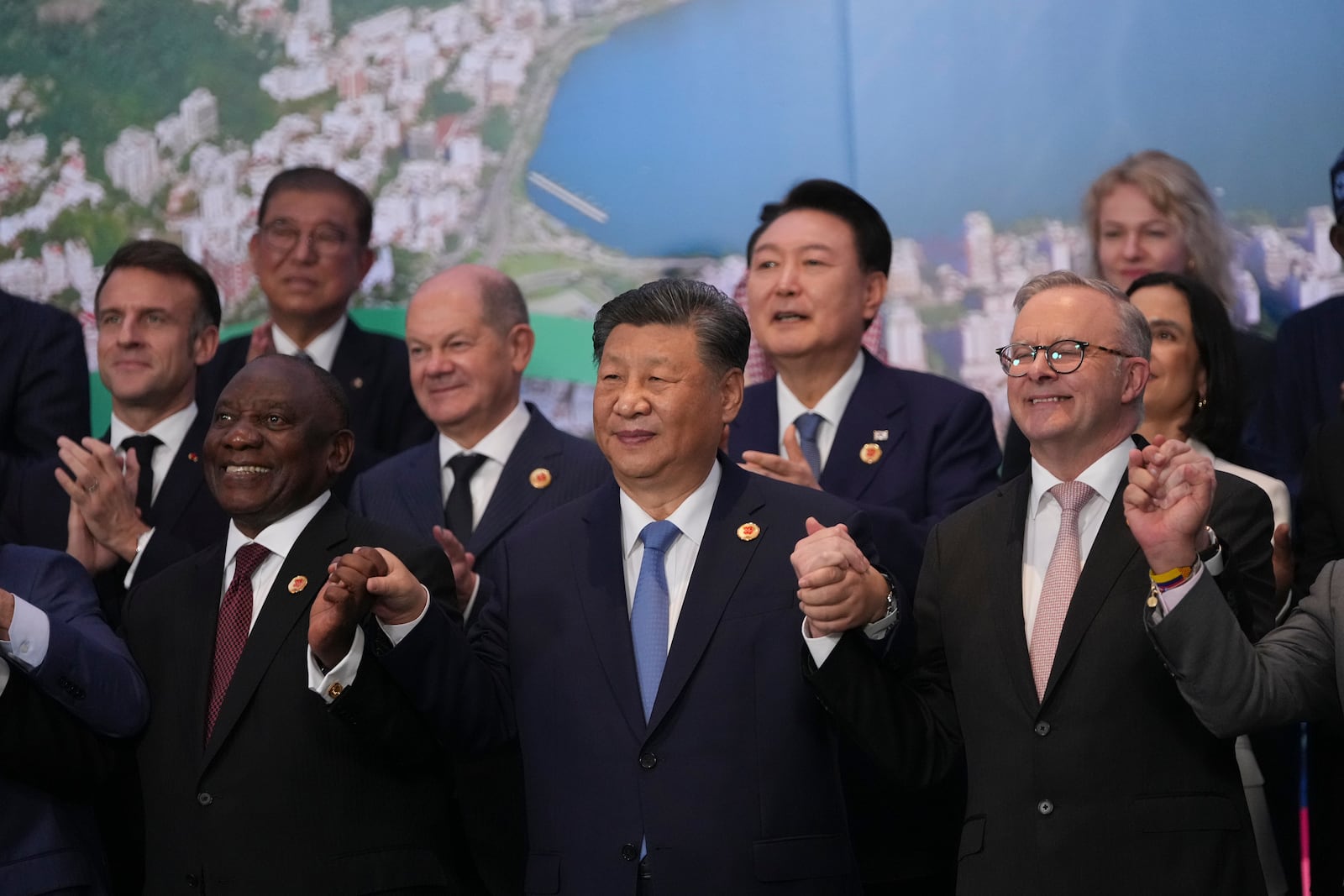 World leaders attending the G20 Summit pose for a group photo in Rio de Janeiro, Tuesday, Nov. 19, 2024. (AP Photo/Silvia Izquierdo)