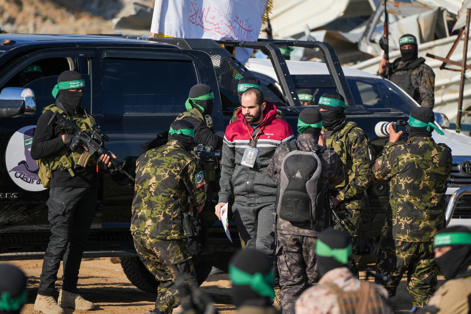 Israeli Yarden Bibas, 34, who has been held hostage by Hamas in Gaza since October 7, 2023, is escorted by Hamas fighters before being handed over to the Red Cross in Khan Younis, southern Gaza Strip, Saturday Feb. 1, 2025. Photo/Abdel Kareem)