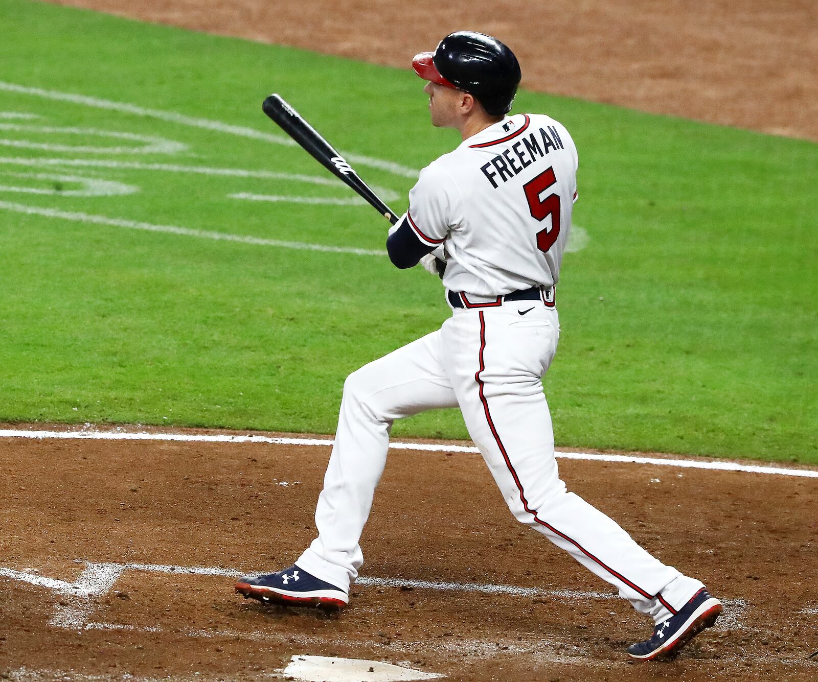 Atlanta Braves' Freddie Freeman watches his two-run home run against the Miami Marlins during the third inning of a baseball game Wednesday, Sept. 9, 2020 in Atlanta. (Curtis Compton/Atlanta Journal-Constitution via AP)