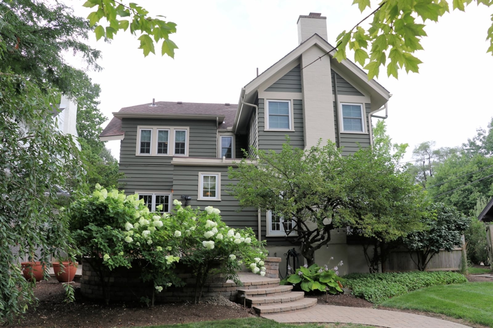 Built in 1915 and located in the Schantz Historical District, the property has a deep landscaped backyard surrounded by a wooden privacy fence. 