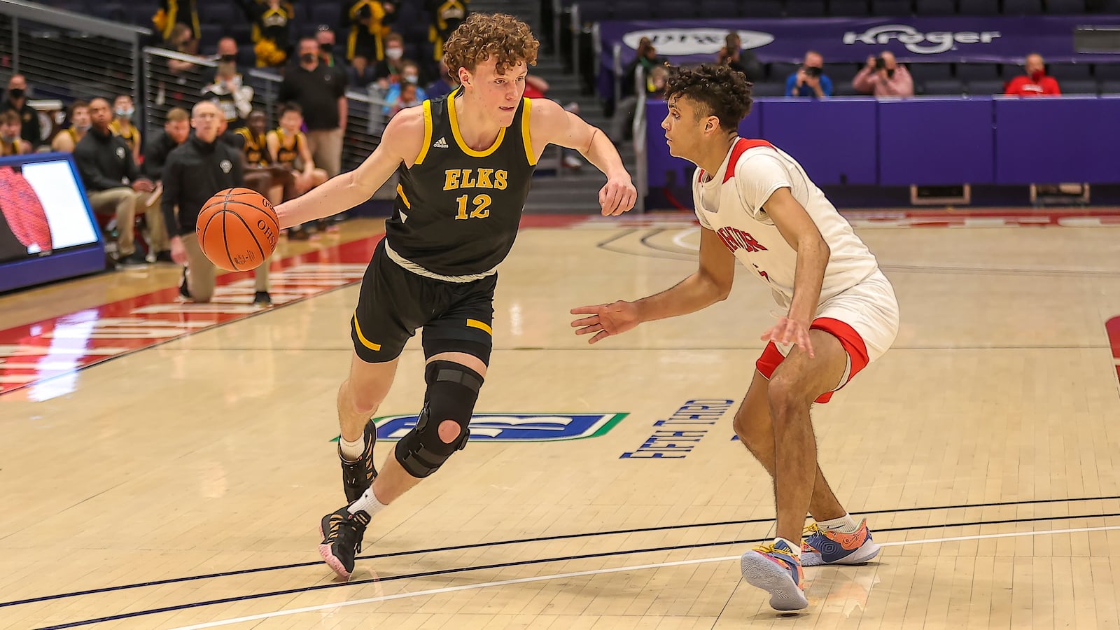 Centerville High School junior Tom House drives past Mentor's Jonah Waag during their game on Saturday night at UD Arena. Michael Cooper/CONTRIBUTED