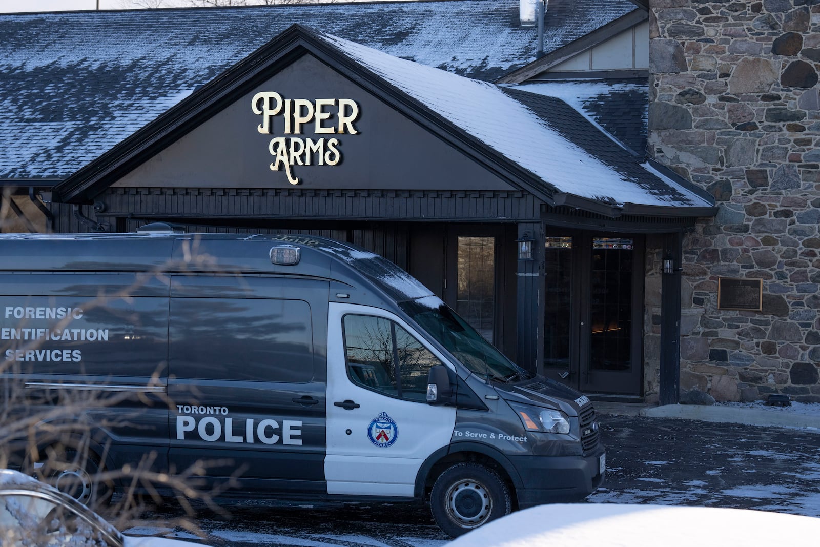 Police attend the scene of a shooting at a pub in Toronto, Canada, Saturday, March 8, 2025. (Arlyn McAdorey/The Canadian Press via AP)