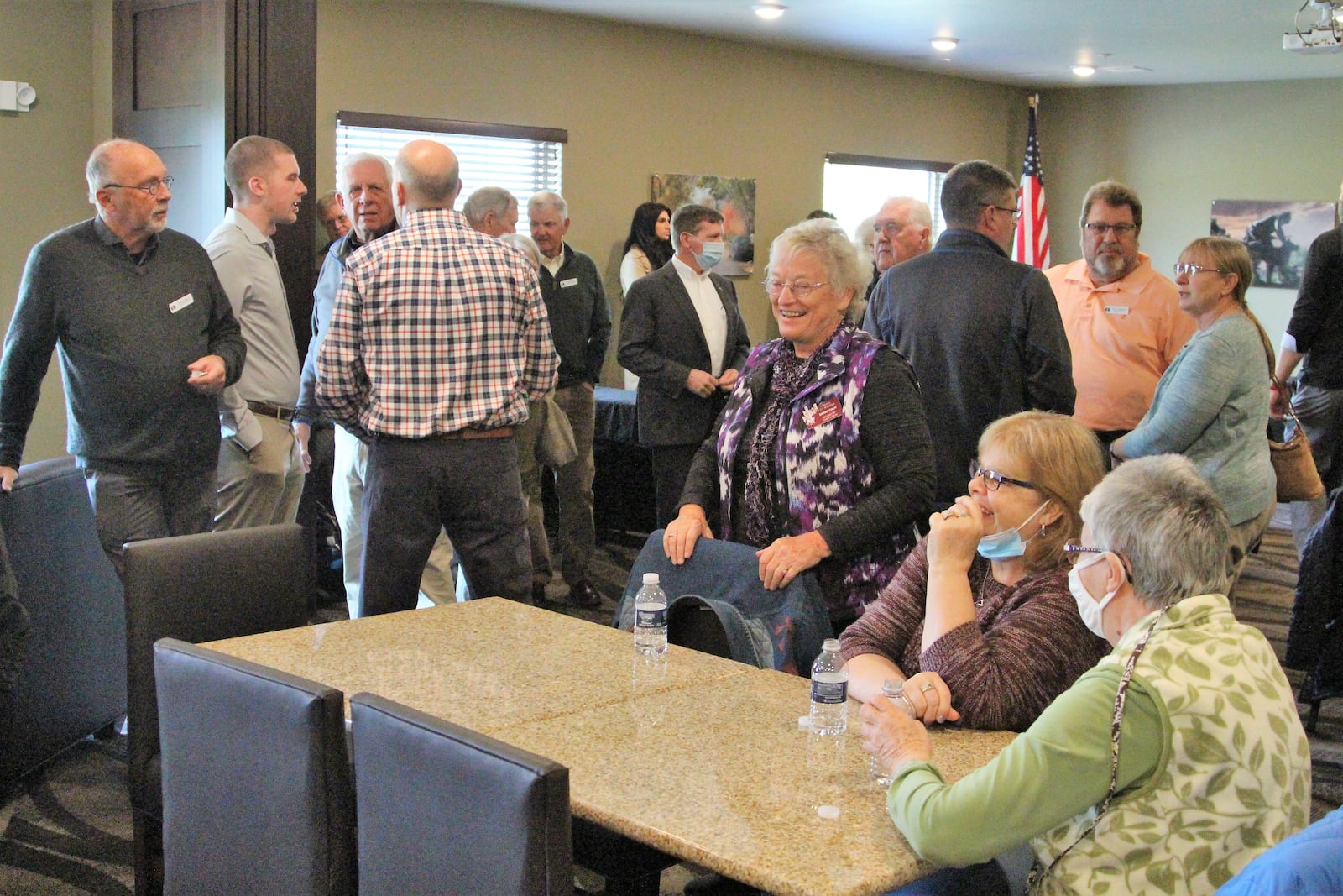 People gather at the Cobblestone Hotel in Urbana on Thursday to celebrate an official grand opening and ceremonial ribbon cutting. Hasan Karim/Staff