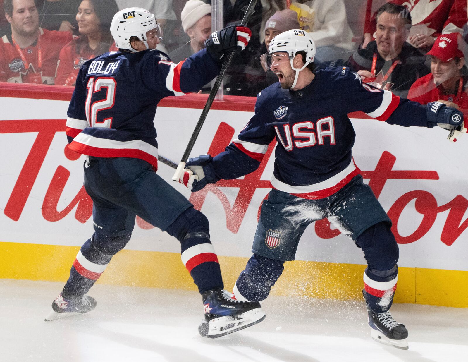 United States' Dylan Larkin (right) celebrates his goal over Canada with teammate Matt Boldy (12) during second period 4 Nations Face-Off hockey action in Montreal on Saturday, Feb. 15, 2025. (Christinne Muschi/The Canadian Press via AP)