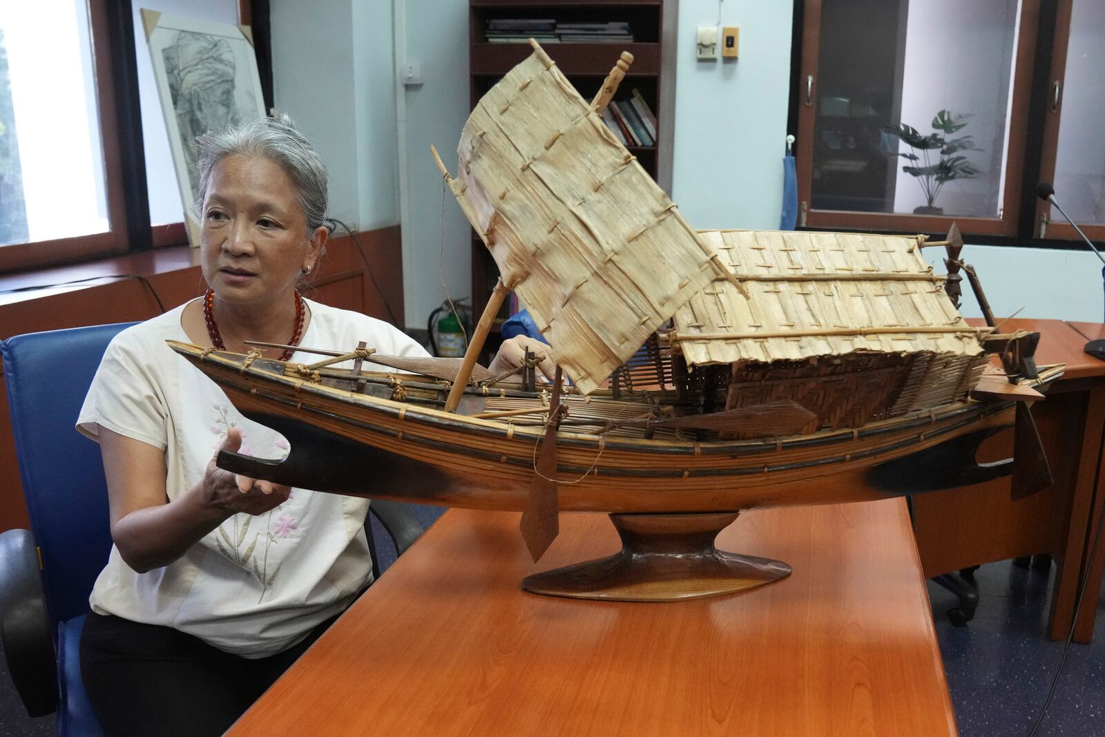 Narumon Arunotai, who works closely with the Moken and indigenous communities, speaks during an interview with The Associated Press, discussing the Kabang boat at Chualongkorn University in Bangkok, Thailand, Monday, Dec. 2, 2024. (AP Photo/Sakchai Lalit)