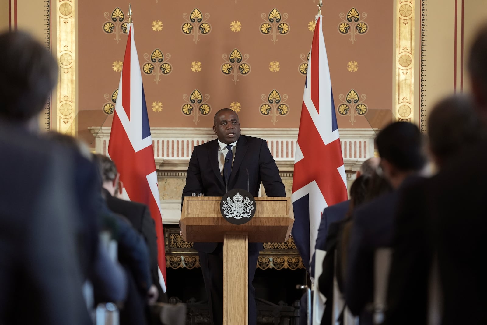 Britain's Foreign Secretary David Lammy delivers a speech on the government plans for new sanctions which will target the finances of people smuggling networks as part of efforts to stop migrants crossing the English Channel, in London, Thursday, Jan. 9, 2025. (Stefan Rousseau/Pool Photo via AP)