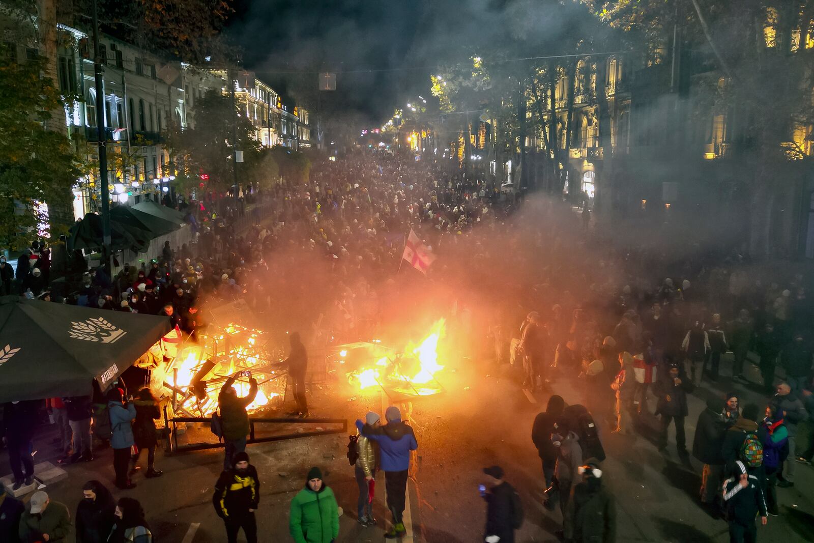 FILE - Protesters pour into the streets outside the parliament building in Tbilisi, Georgia, Nov. 29, 2024. (AP Photo/Zurab Tsertsvadze, File)