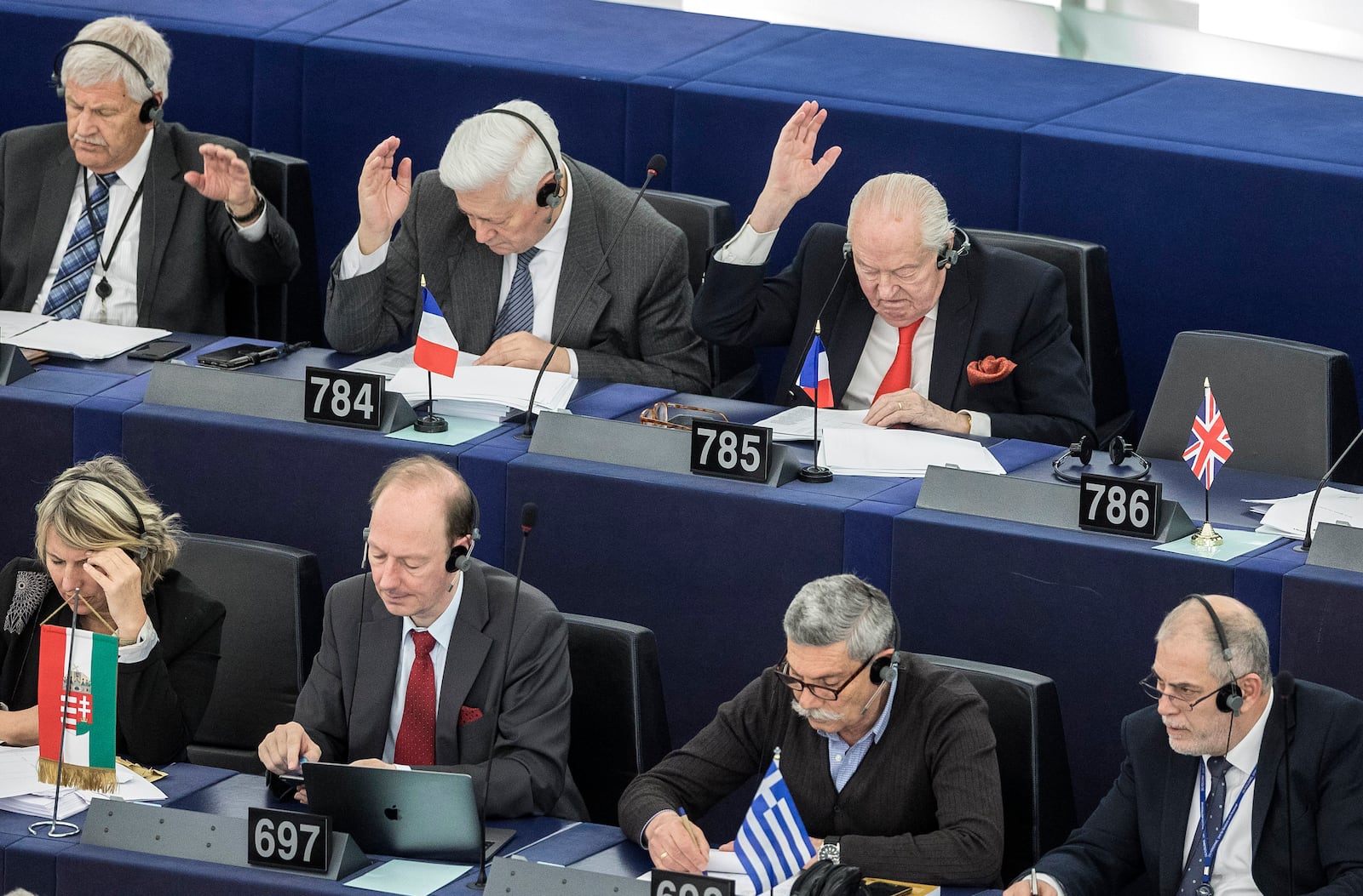 FILE - Former far-right National Front party leader Jean-Marie Le Pen, top right, attends his last plenary session at the European Parliament in Strasbourg, aastern France, Tuesday April 16, 2019. (AP Photo/Jean-Francois Badias, File)