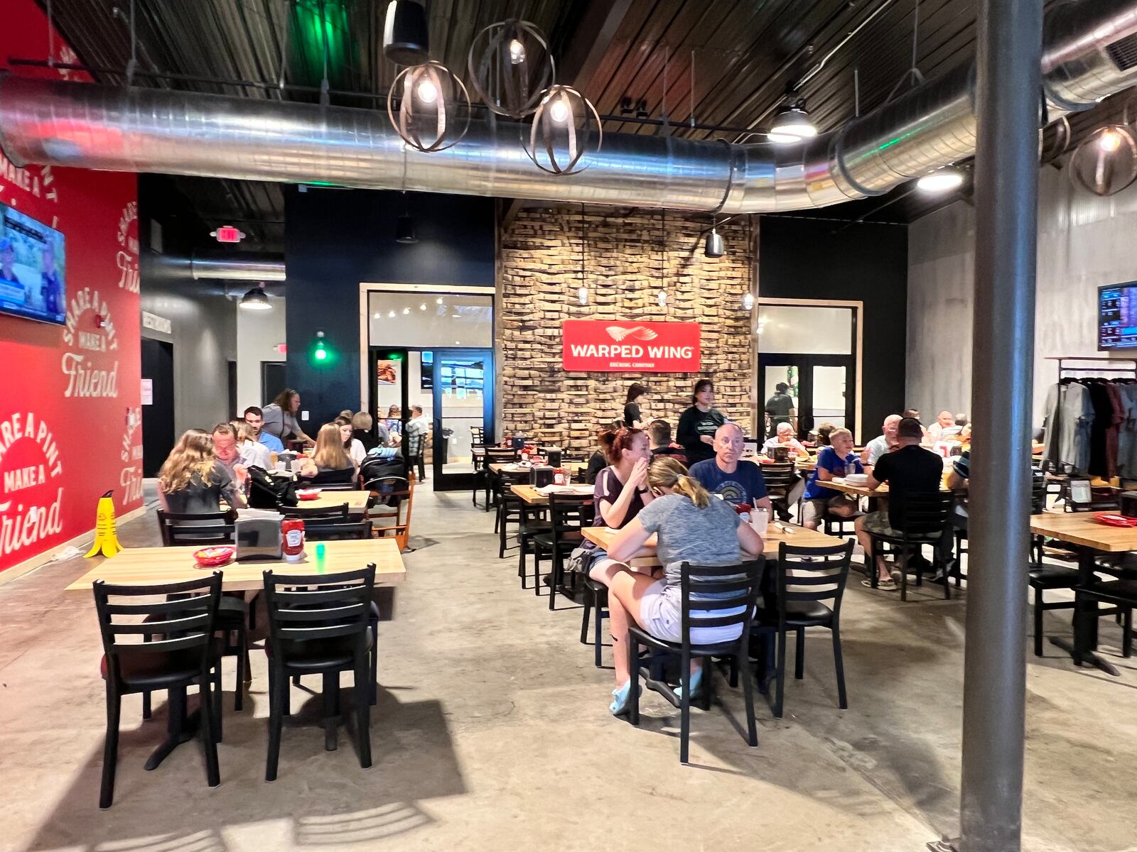 Warped Wing Brewery & Smokery in Huber Heights is an open industrial space with plenty of natural light. ALEXIS LARSEN/CONTRIBUTOR