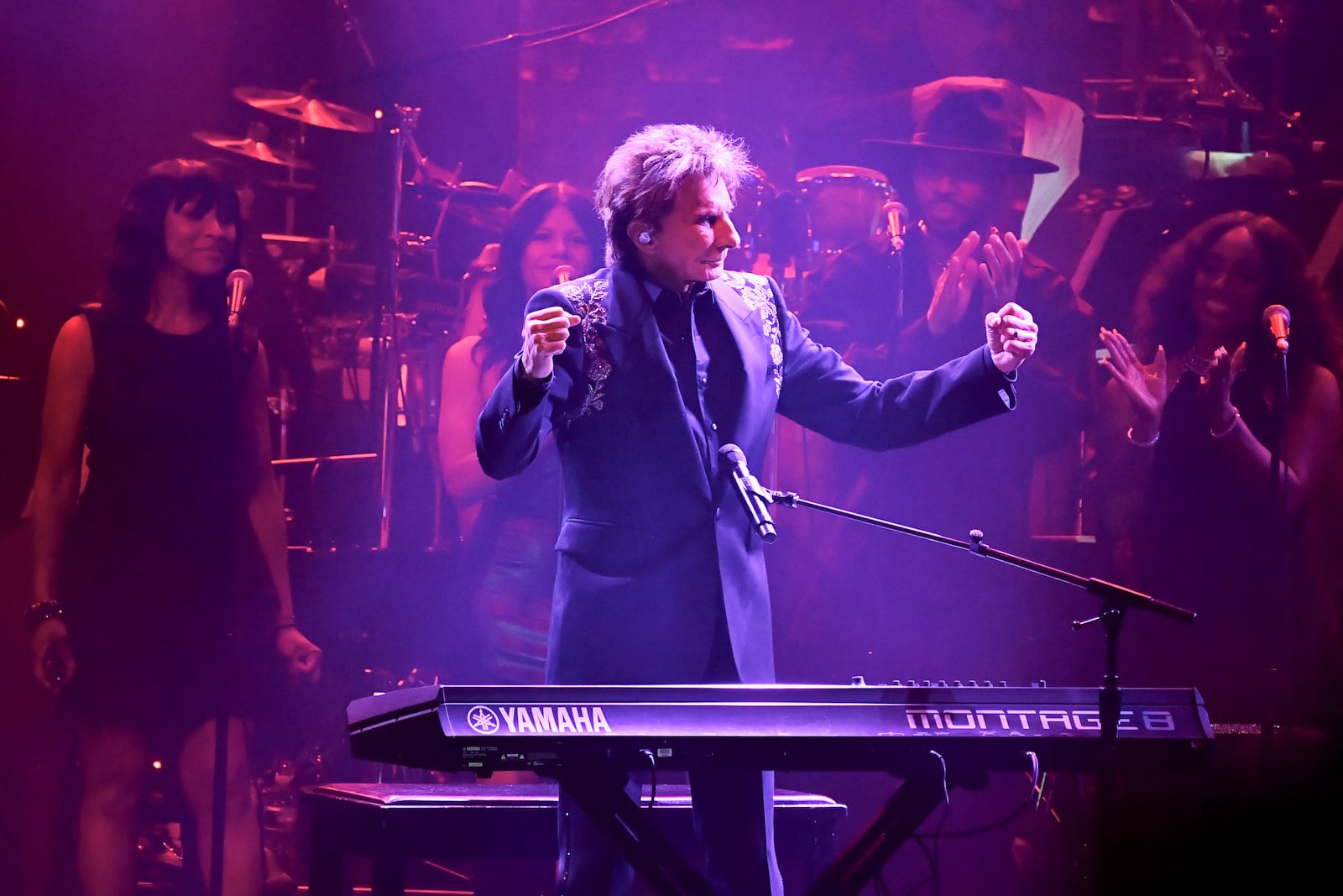 Barry Manilow, center, performs during the Pre-Grammy Gala on Saturday, Feb. 1, 2025, at the Beverly Hilton Hotel in Beverly Hills, Calif. (Photo by Richard Shotwell/Invision/AP)