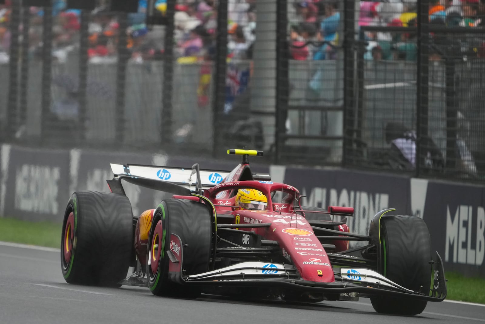 Ferrari driver Lewis Hamilton of Britain steers his car during the Australian Formula One Grand Prix at Albert Park, in Melbourne, Australia, Sunday, March 16, 2025. (AP Photo/Asanka Brendon Ratnayake)