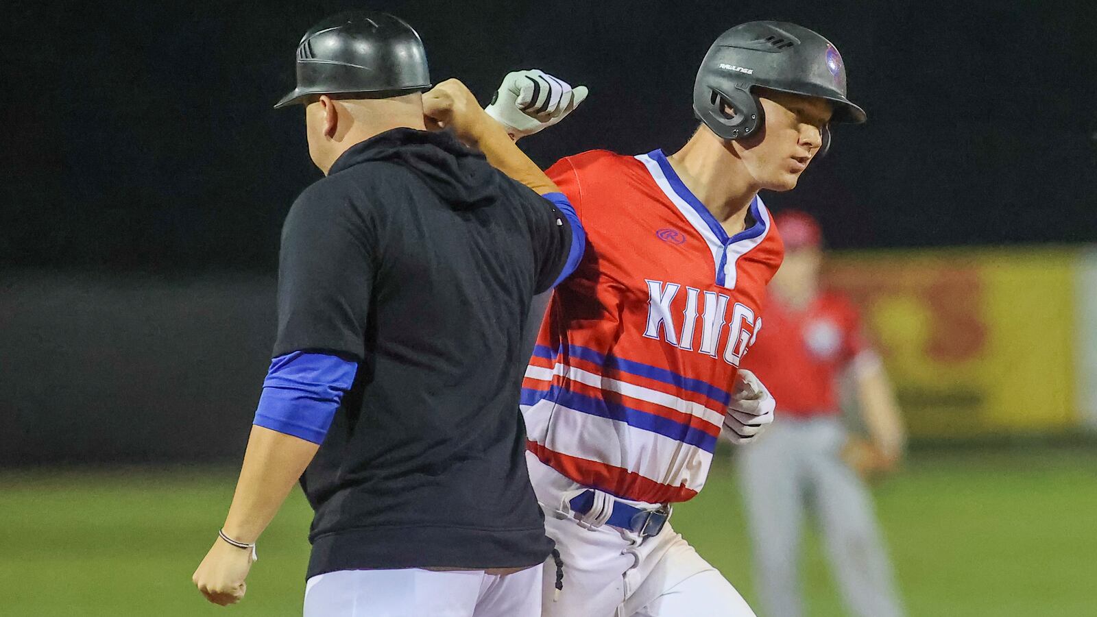 Champion City Kings outfielder Mitchell Okuley celebrates with Kings manager Gavin Murphy after hitting a game-tying home run in the bottom of the ninth inning. The Kings beat the Chillicothe Paints 10-9 on Thursday night at Carleton Davidson Stadium in Springfield. Michael Cooper/CONTRIBUTED