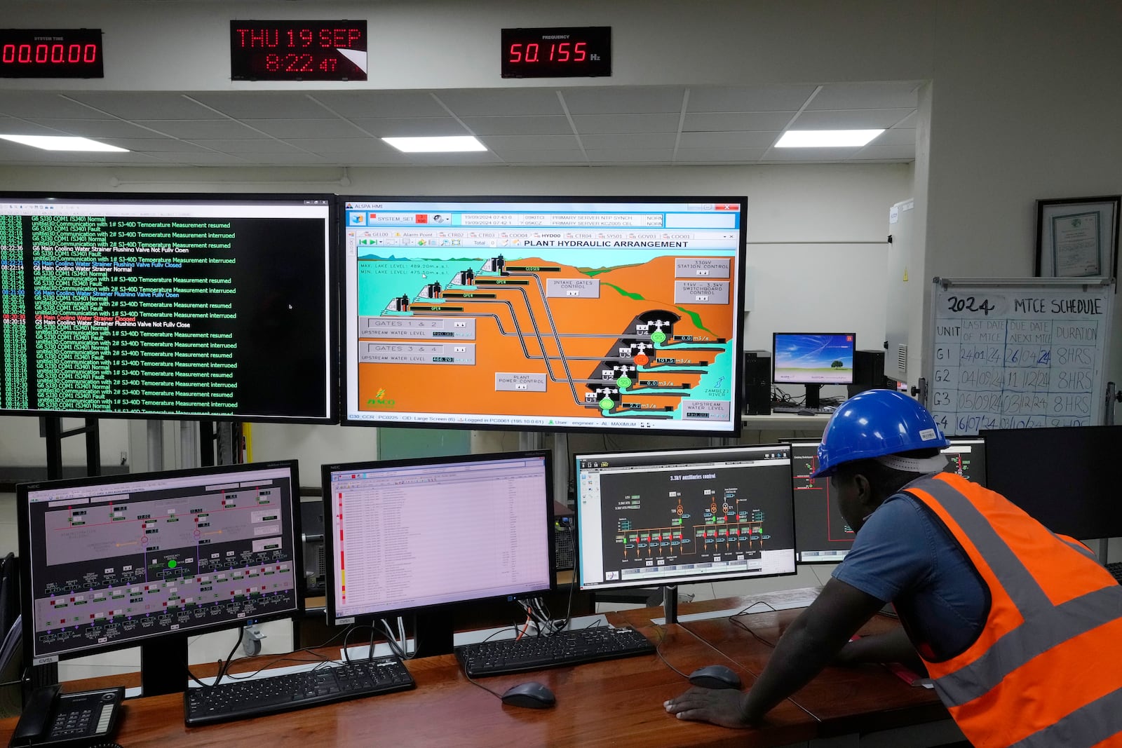 Engineer Chrispin Ndoti works in a control room for the Kariba dam near Siavonga, Zambia, Thursday, Sept. 19, 2024. (AP Photo/Themba Hadebe)