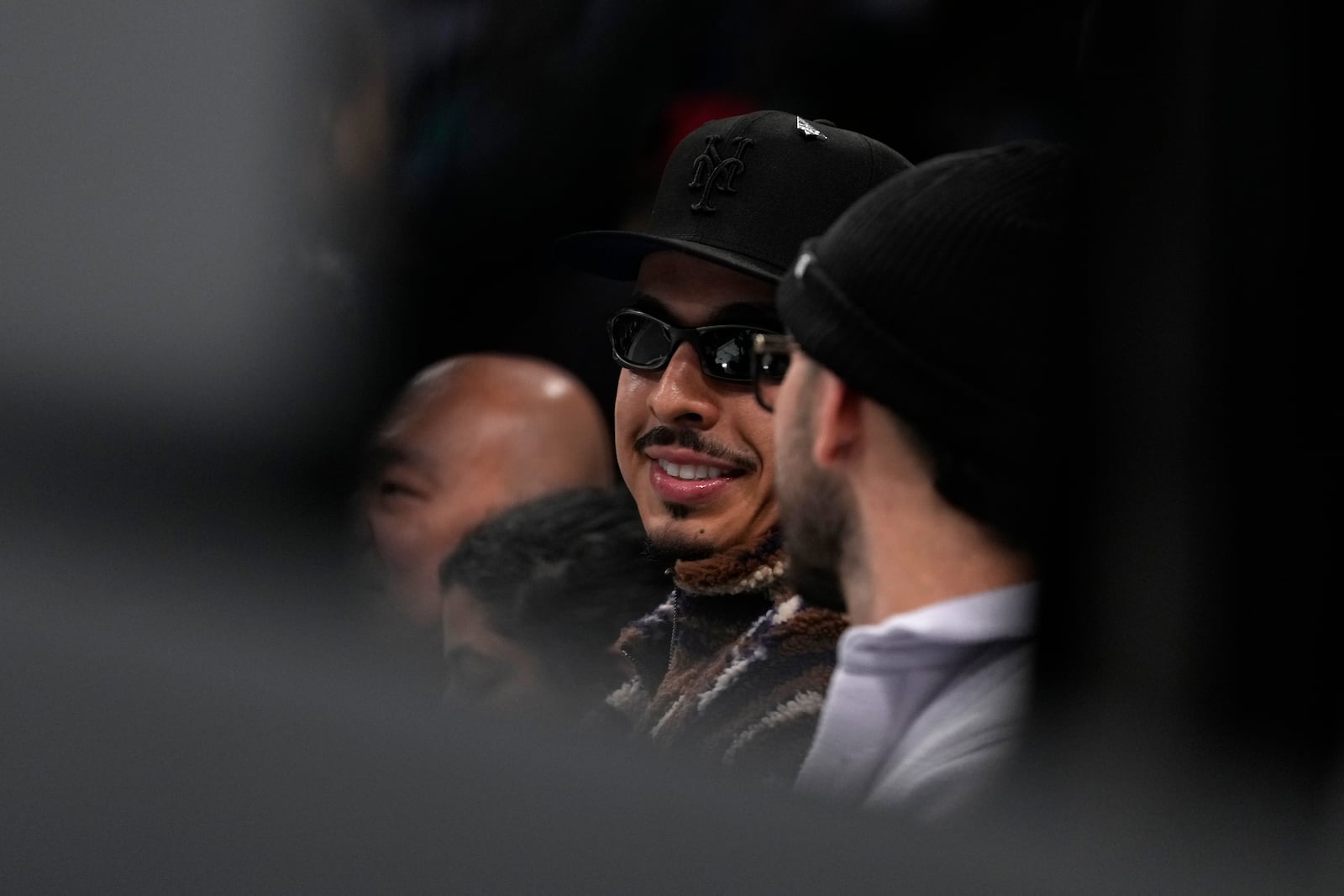 New York Mets third baseman Mark Vientos watches the first half of Game 1 of a WNBA basketball final playoff series between the New York Liberty and the Minnesota Lynx, Thursday, Oct. 10, 2024, in New York. (AP Photo/Pamela Smith)