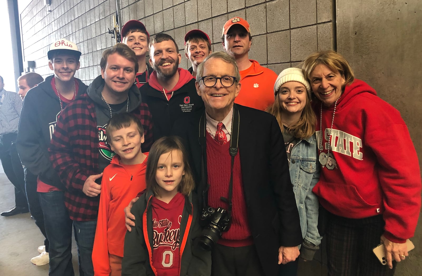 Ohio governor Mike DeWine (center) is flanked by family members at State Farm Stadium in Glendale, Ariz., prior to Ohio State's matchup with Clemson in the Fiesta Bowl on Dec. 28, 2019.