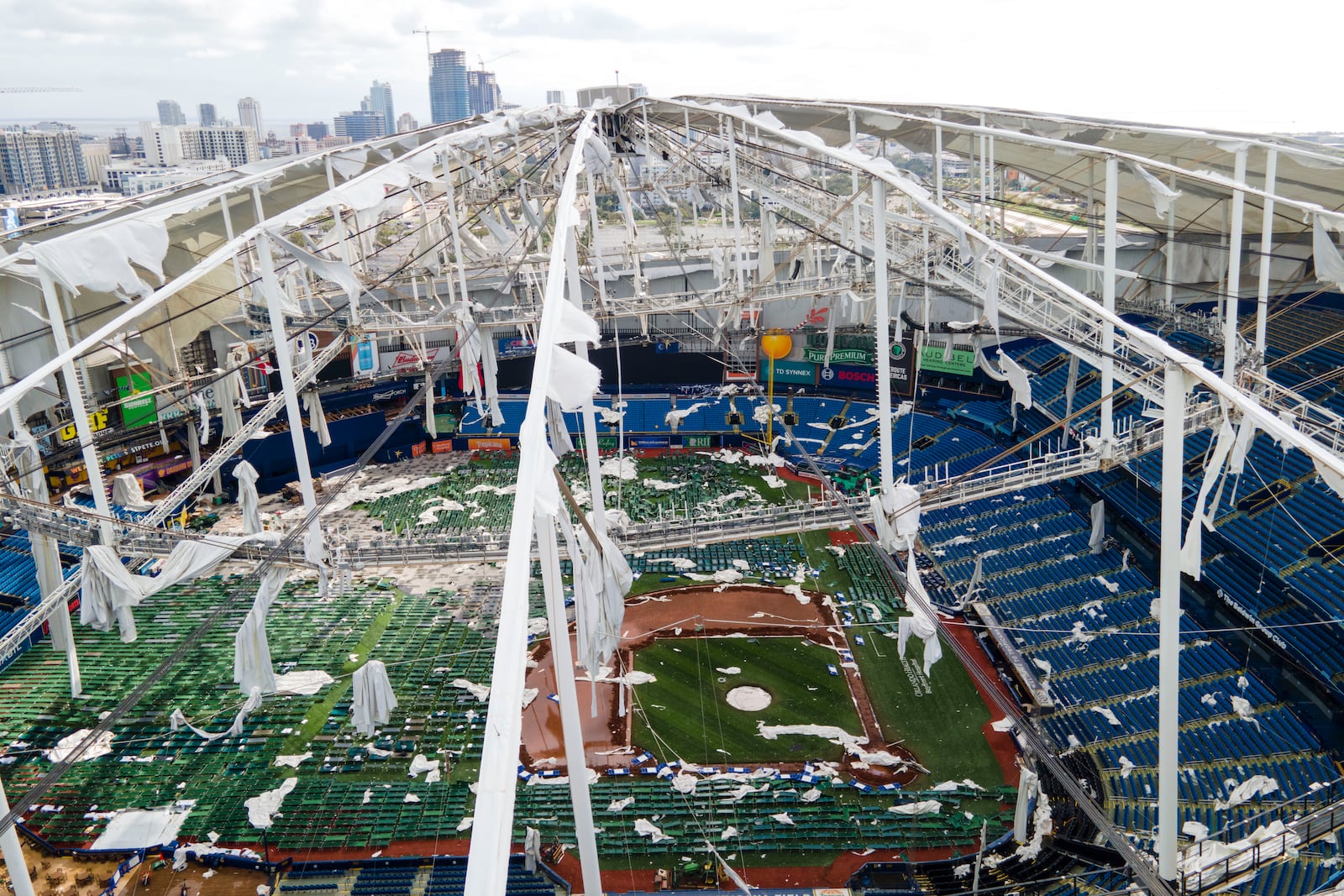 The roof of the Tropicana Field is damaged the morning after Hurricane Milton hit the region, Thursday, Oct. 10, 2024, in St. Petersburg, Fla. (AP Photo/Julio Cortez)