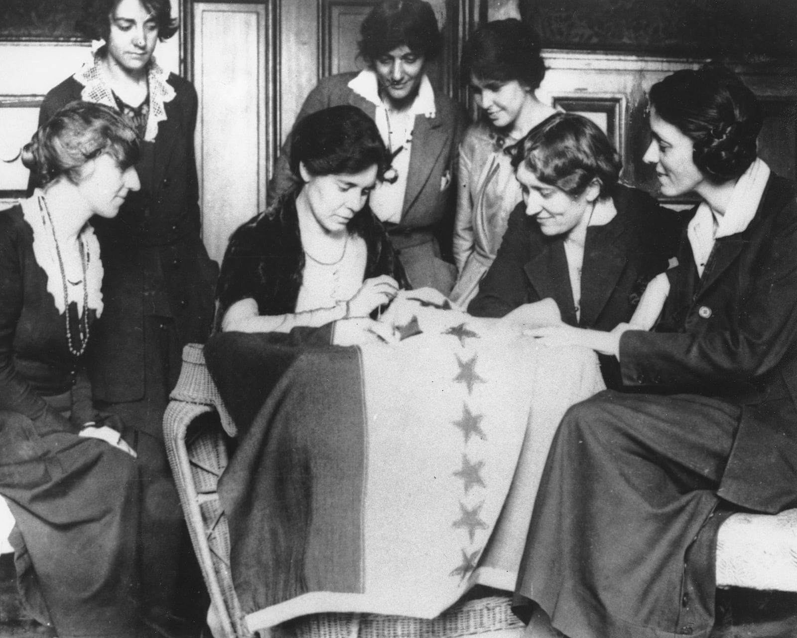 FILE - Alice Paul, seated second from left, sews the 36th star on a banner, celebrating the ratification of the women's suffrage amendment in August 1920. The 36th star represented Tennessee, whose ratification completed the number of states needed to put the amendment in the Constitution. (AP Photo, File)