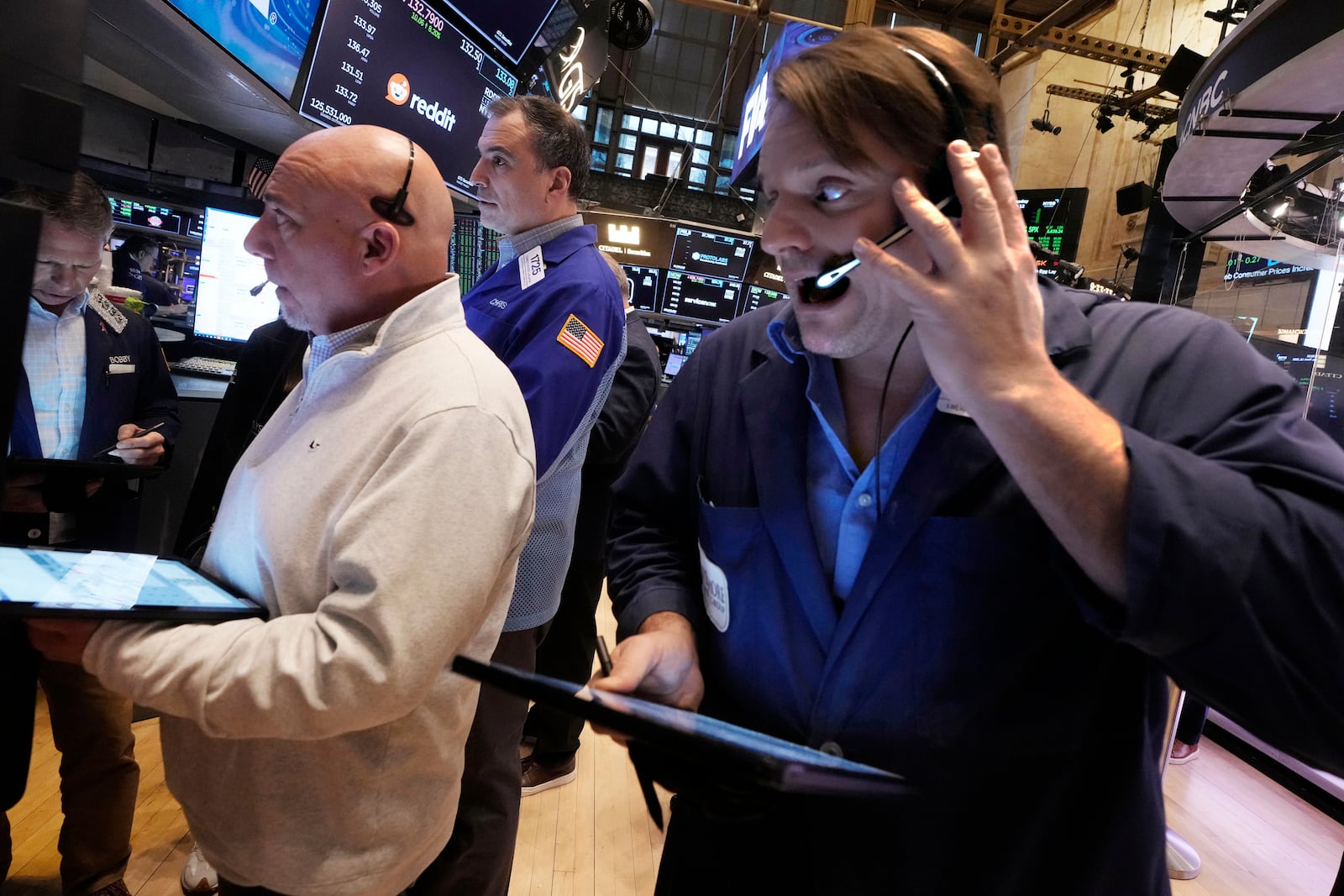 Traders work on the floor of the New York Stock Exchange, Wednesday, March 12, 2025. (AP Photo/Richard Drew)