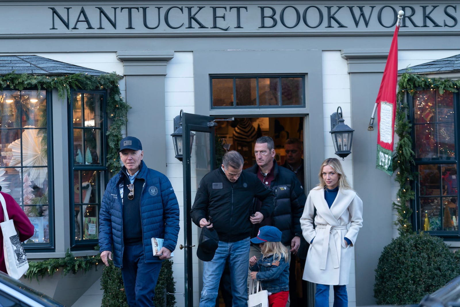 President Joe Biden, from left, his son Hunter Biden, daughter-in-law Melissa Cohen Biden, right, and grandson Beau Biden, leave a book store as they walk in downtown Nantucket, Mass., Friday, Nov. 29, 2024. (AP Photo/Jose Luis Magana)