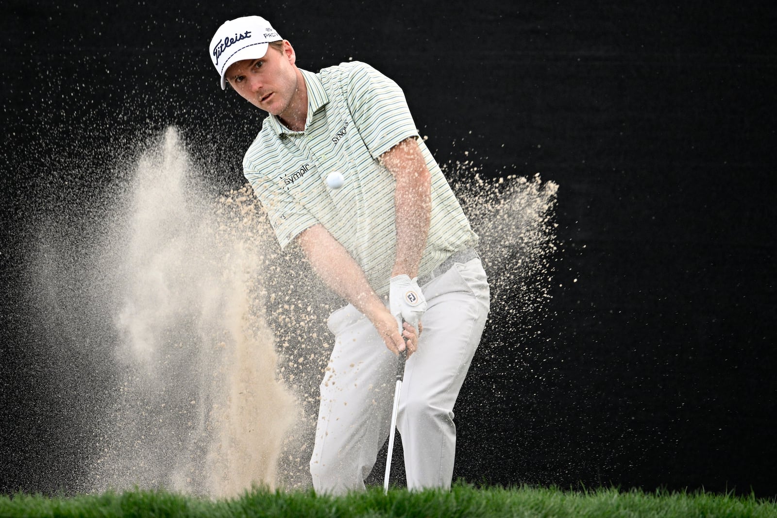 Russell Henley hits out of a bunker onto the 14th green during the third round of the Arnold Palmer Invitational at Bay Hill golf tournament, Saturday, March 8, 2025, in Orlando, Fla. (AP Photo/Phelan M. Ebenhack)