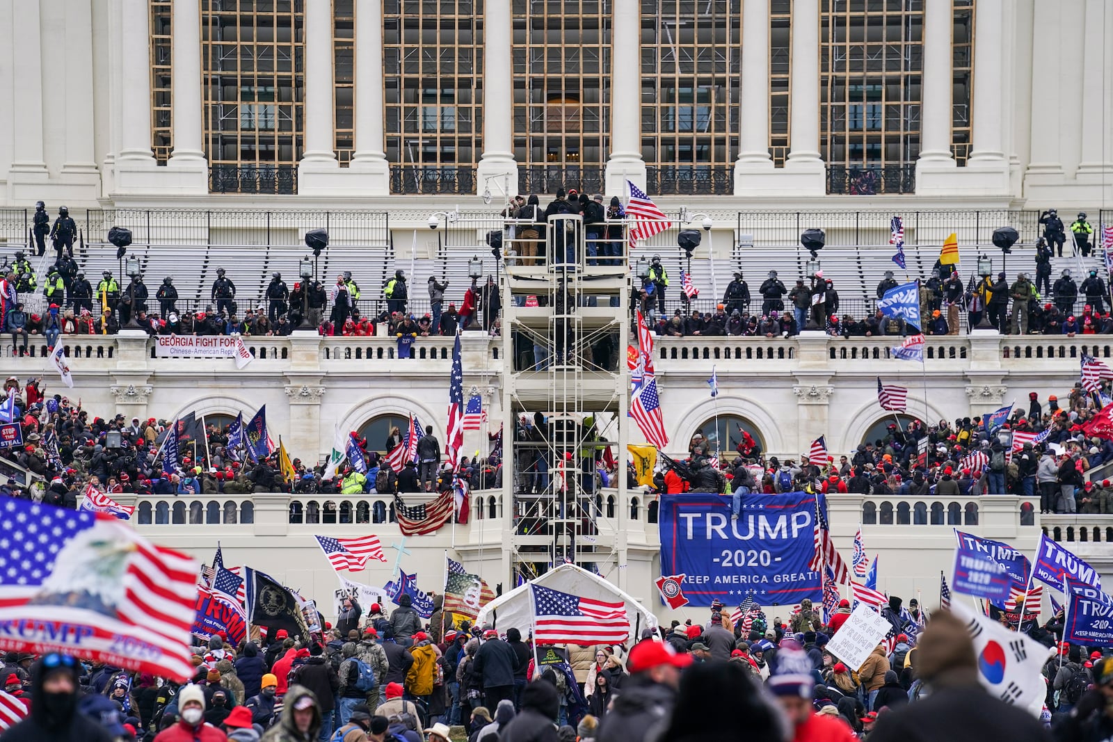 FILE - Insurrectionists loyal to President Donald Trump breach the Capitol in Washington, Jan. 6, 2021. (AP Photo/John Minchillo, File)