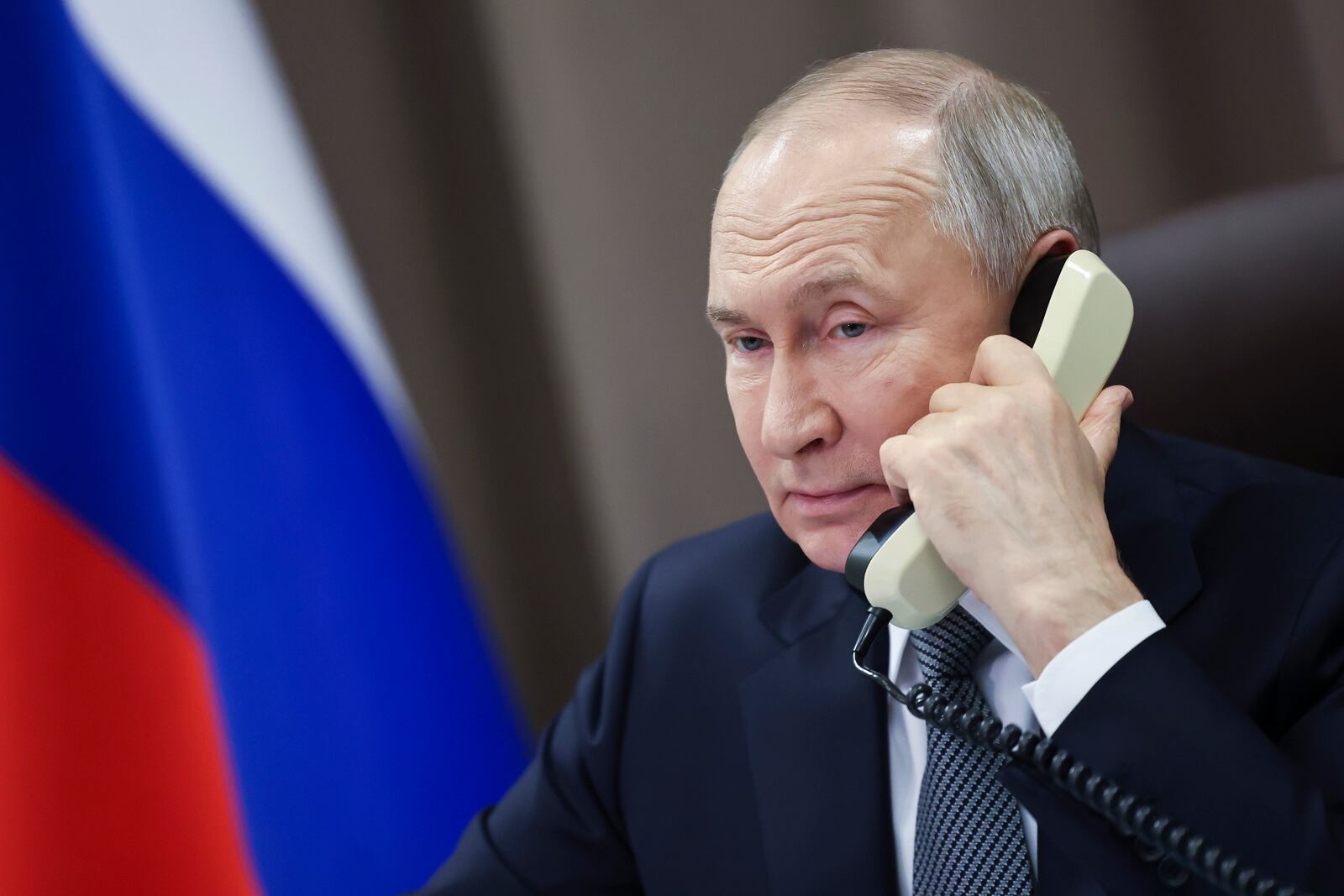 FILE - Russian President Vladimir Putin speaks on the phone with a girl from the Moscow region, as part of a Christmas charity campaign in St. Petersburg, Russia, Dec. 26, 2024. (Alexander Kazakov, Sputnik, Kremlin Pool Photo via AP, File)