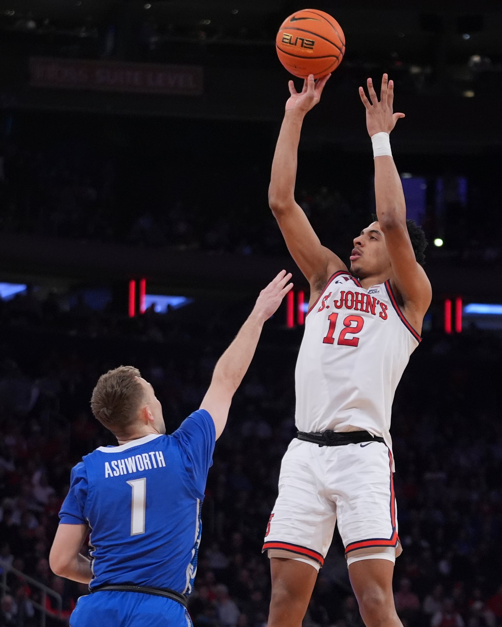 St. John's's RJ Luis Jr. (12) shoots over Creighton's Steven Ashworth (1) during the first half of an NCAA college basketball game in the championship of the Big East Conference tournament Saturday, March 15, 2025, in New York. (AP Photo/Frank Franklin II)